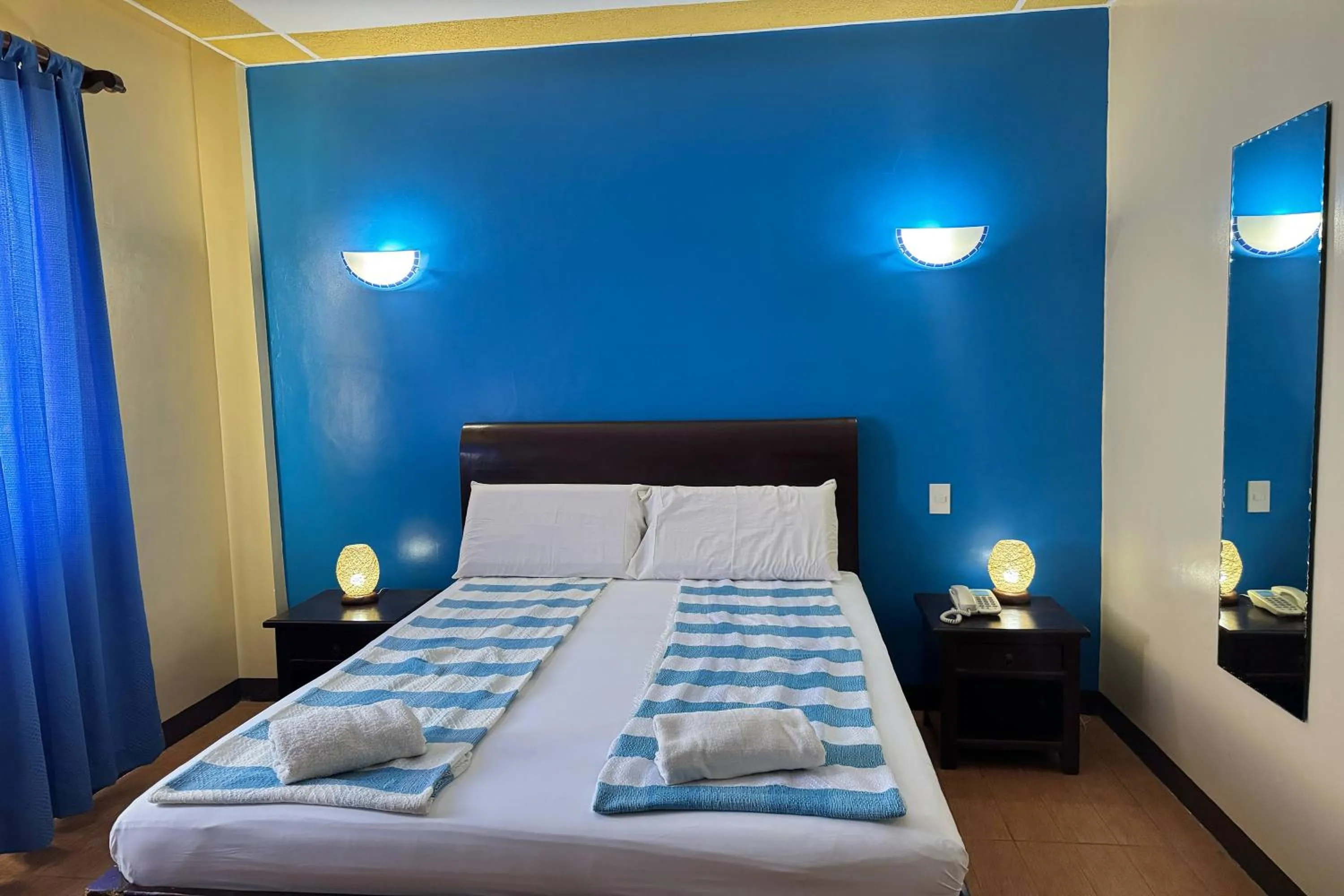 Bed in OveMar Resort Hotel near Vigan