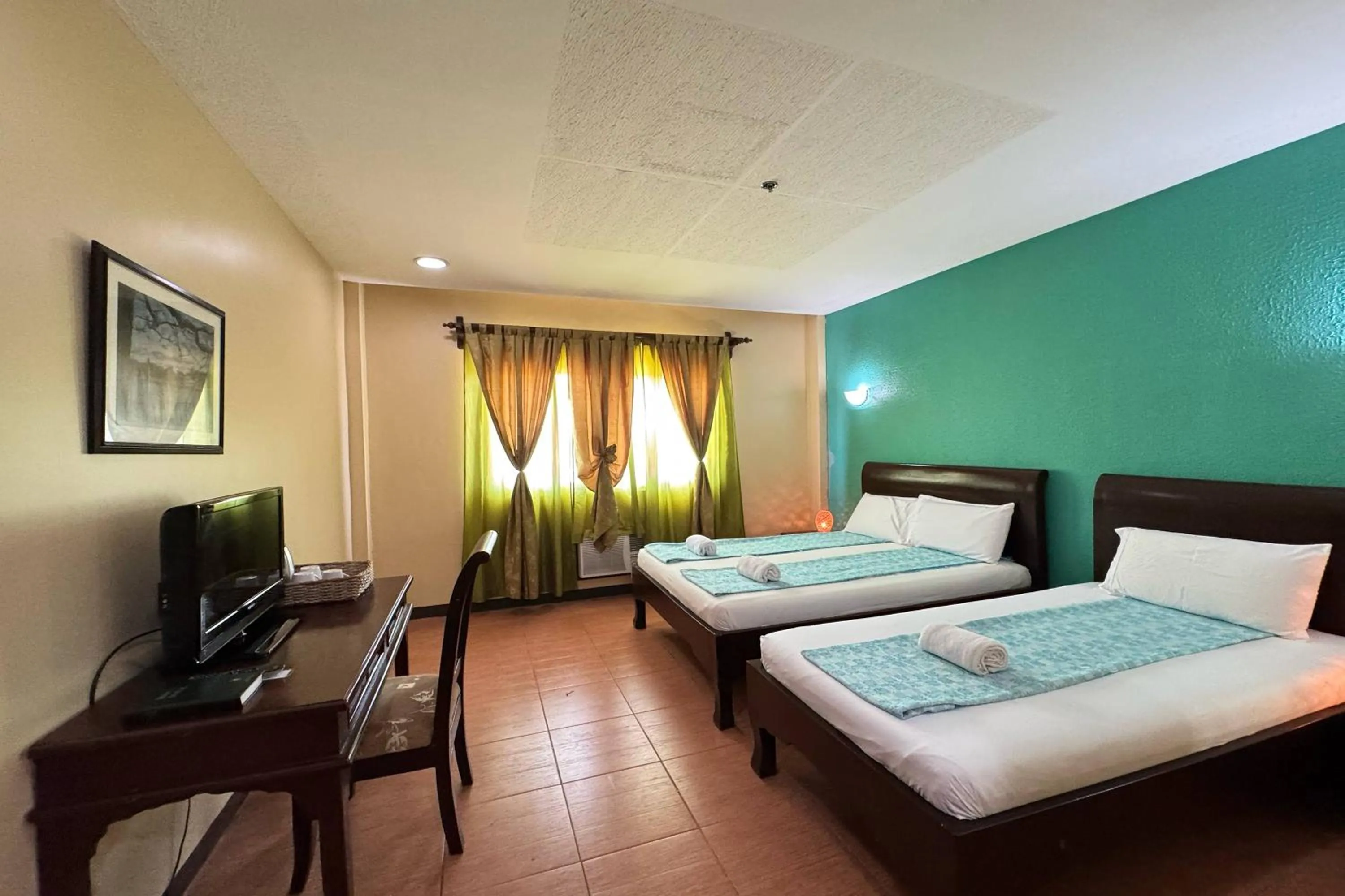 Bed in OveMar Resort Hotel near Vigan