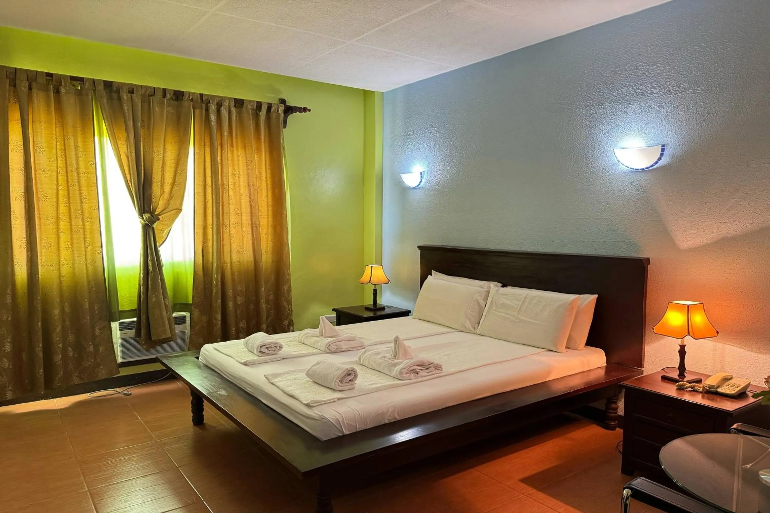 Bed in OveMar Resort Hotel near Vigan