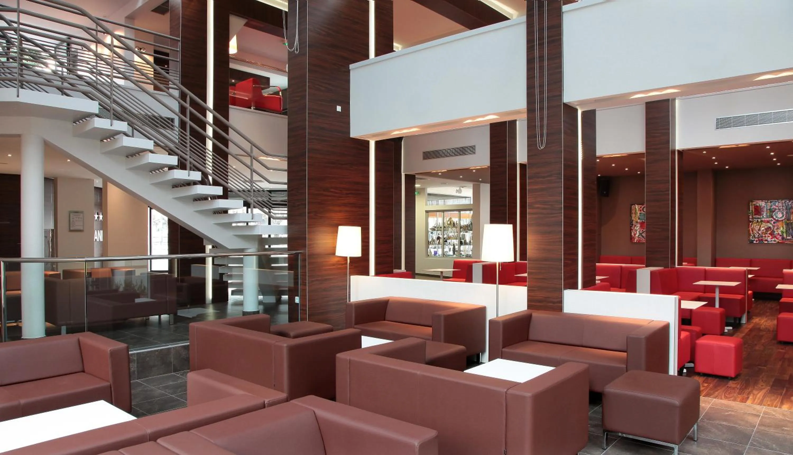 Communal lounge/ TV room in Hôtel Le Méditerranée