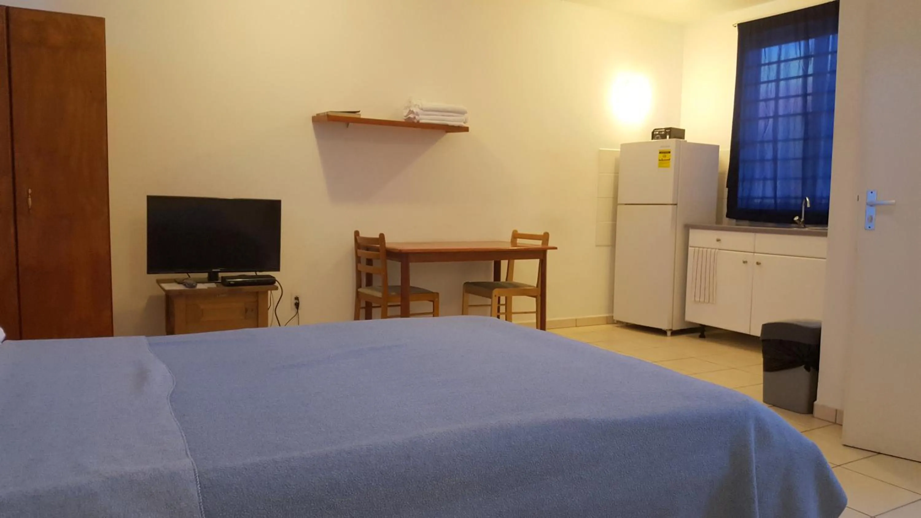 Photo of the whole room, Bed in Orange Rembrandt Studio Apartments