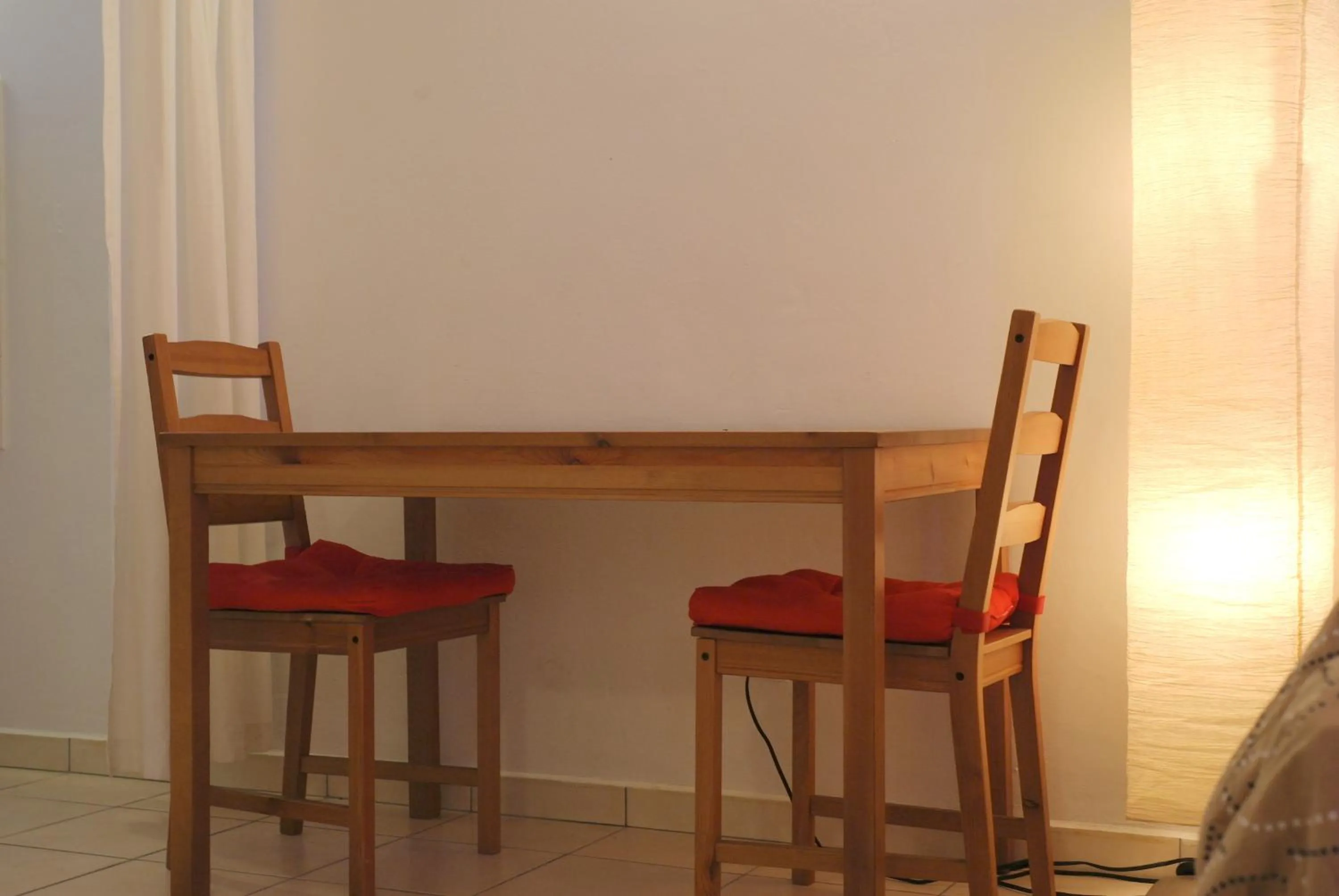 Dining area in Orange Rembrandt Studio Apartments