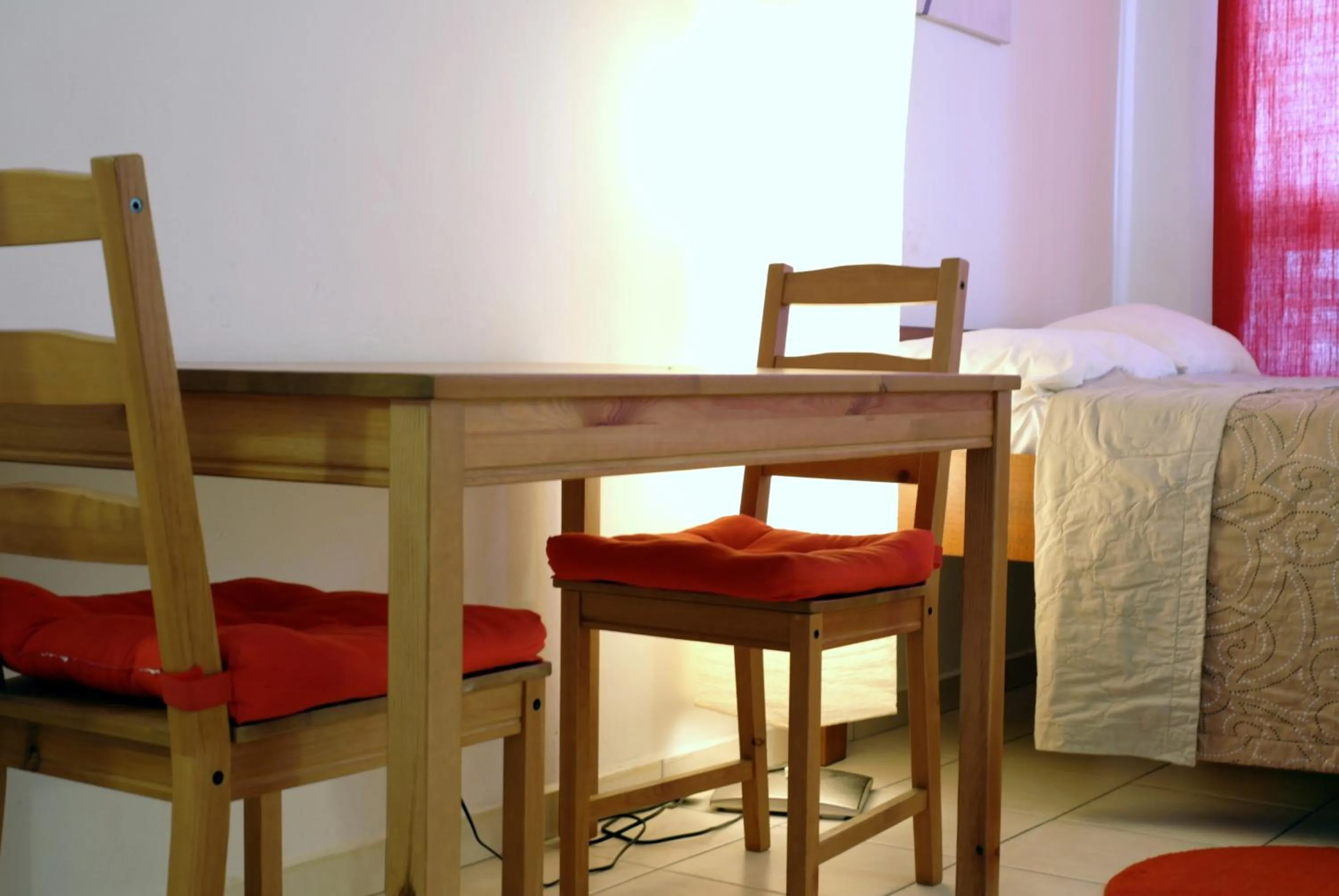 Dining area, Bed in Orange Rembrandt Studio Apartments