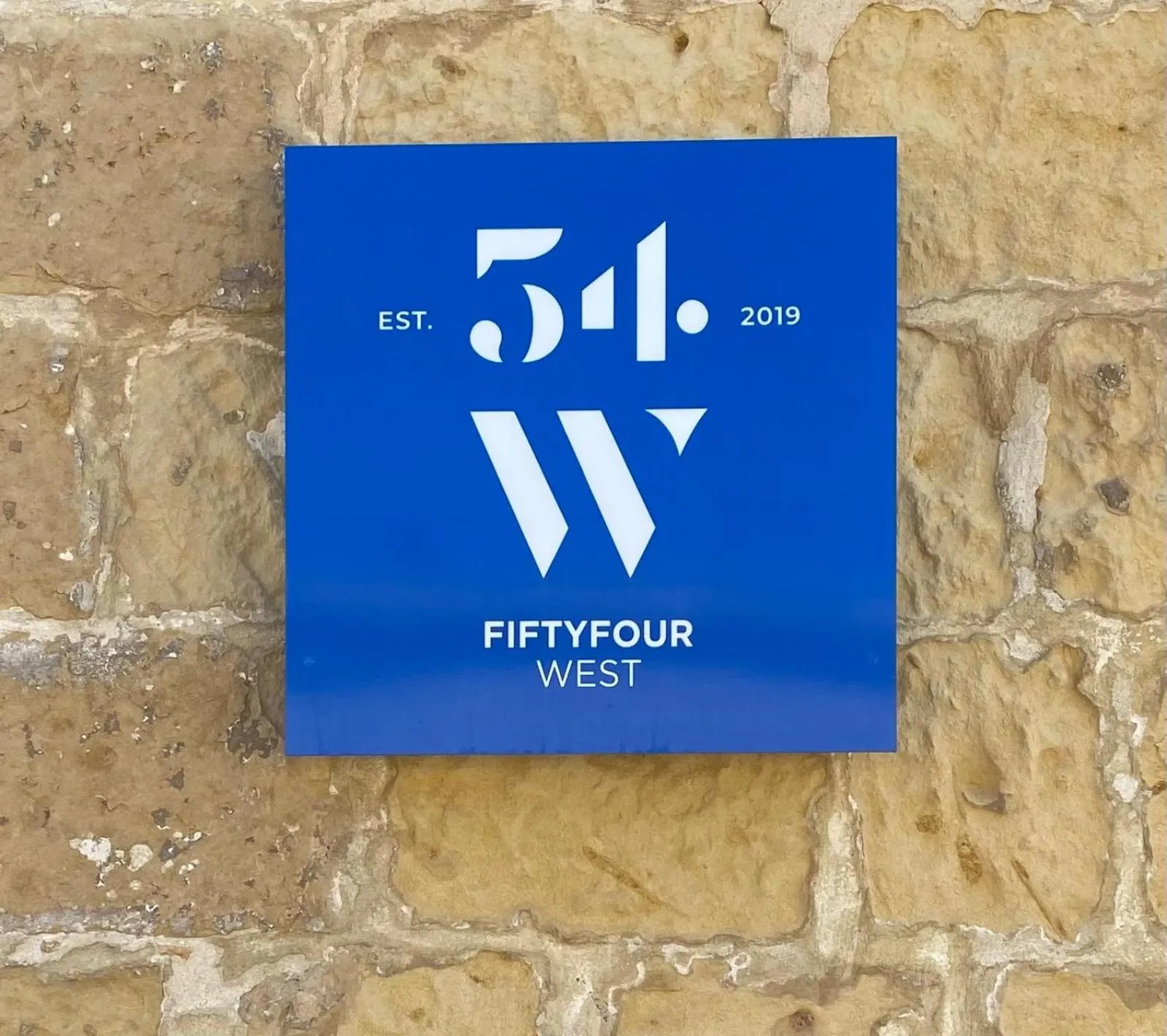 Property logo or sign in Fiftyfour West Boutique Living