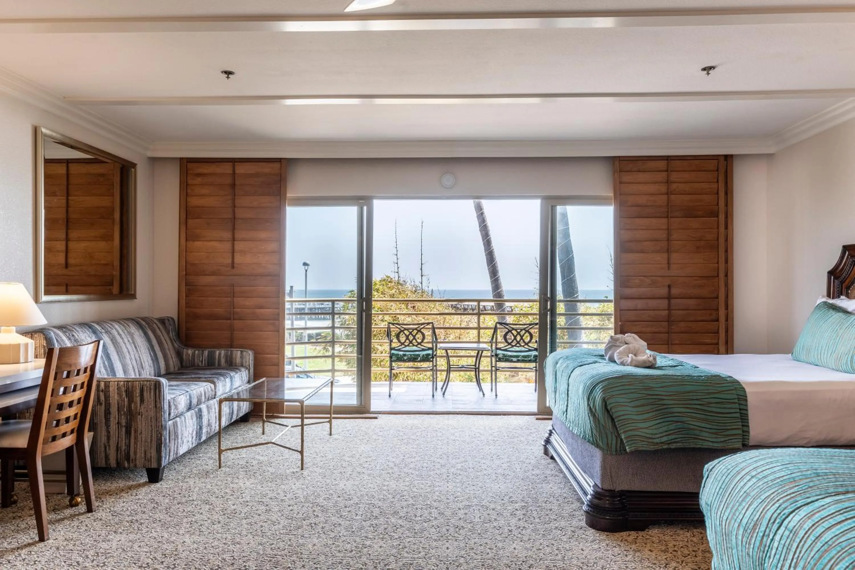 Bed in Pacific Terrace Hotel