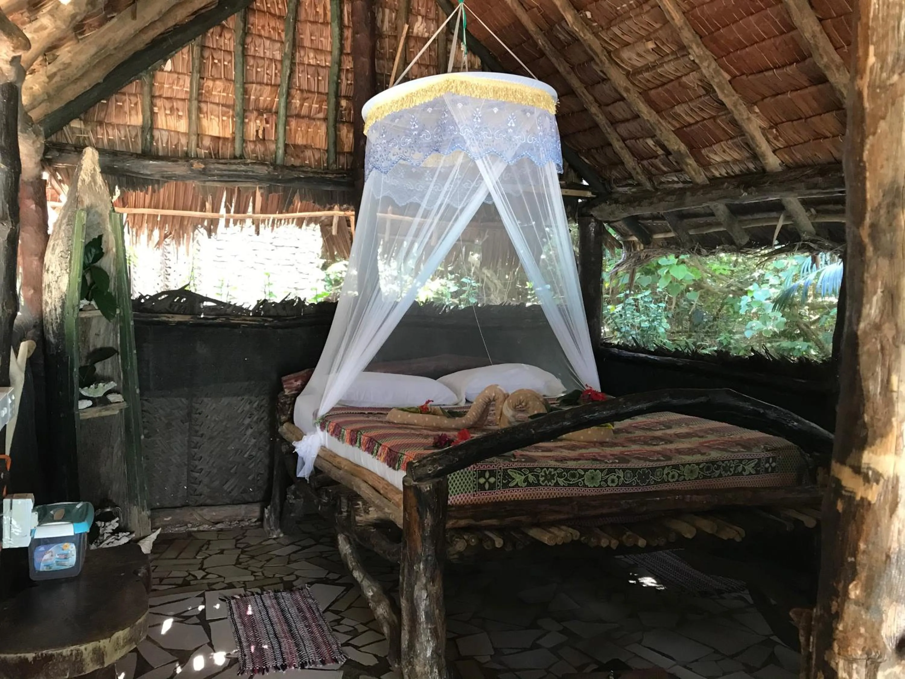 Bedroom in Tranquility Island Eco Dive Resort