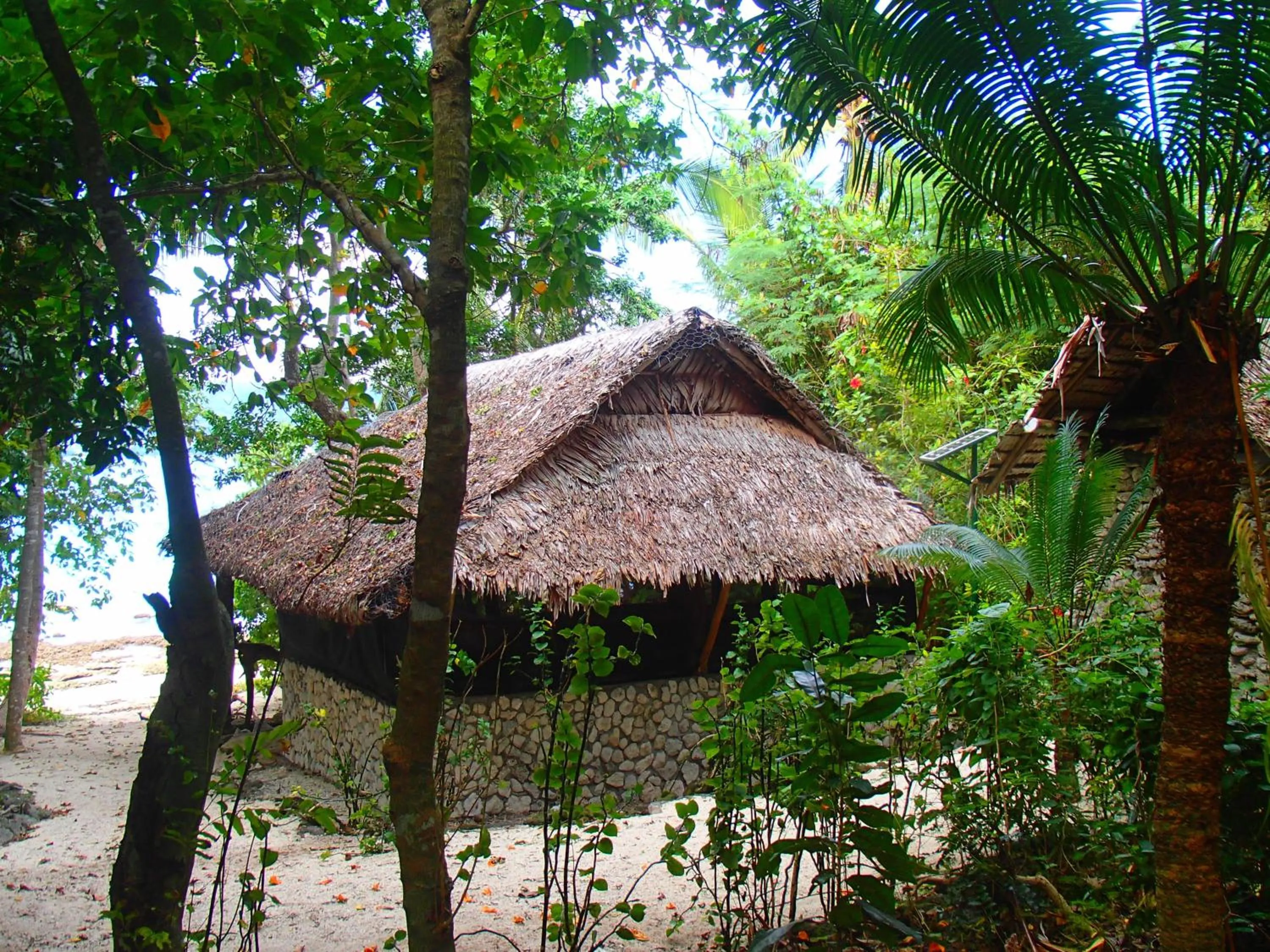 Bedroom in Tranquility Island Eco Dive Resort
