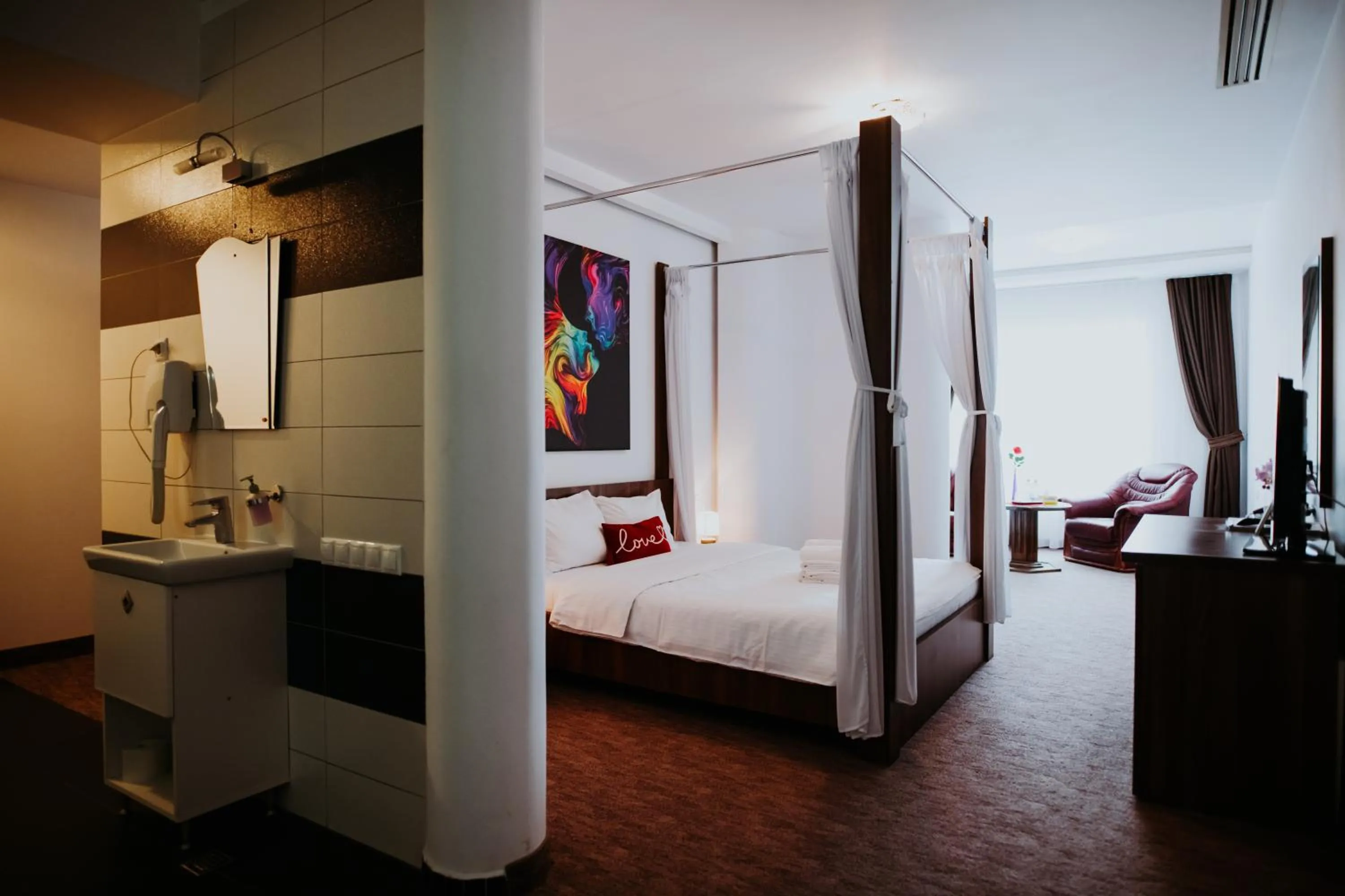 Living room, Bed in Hotel Select