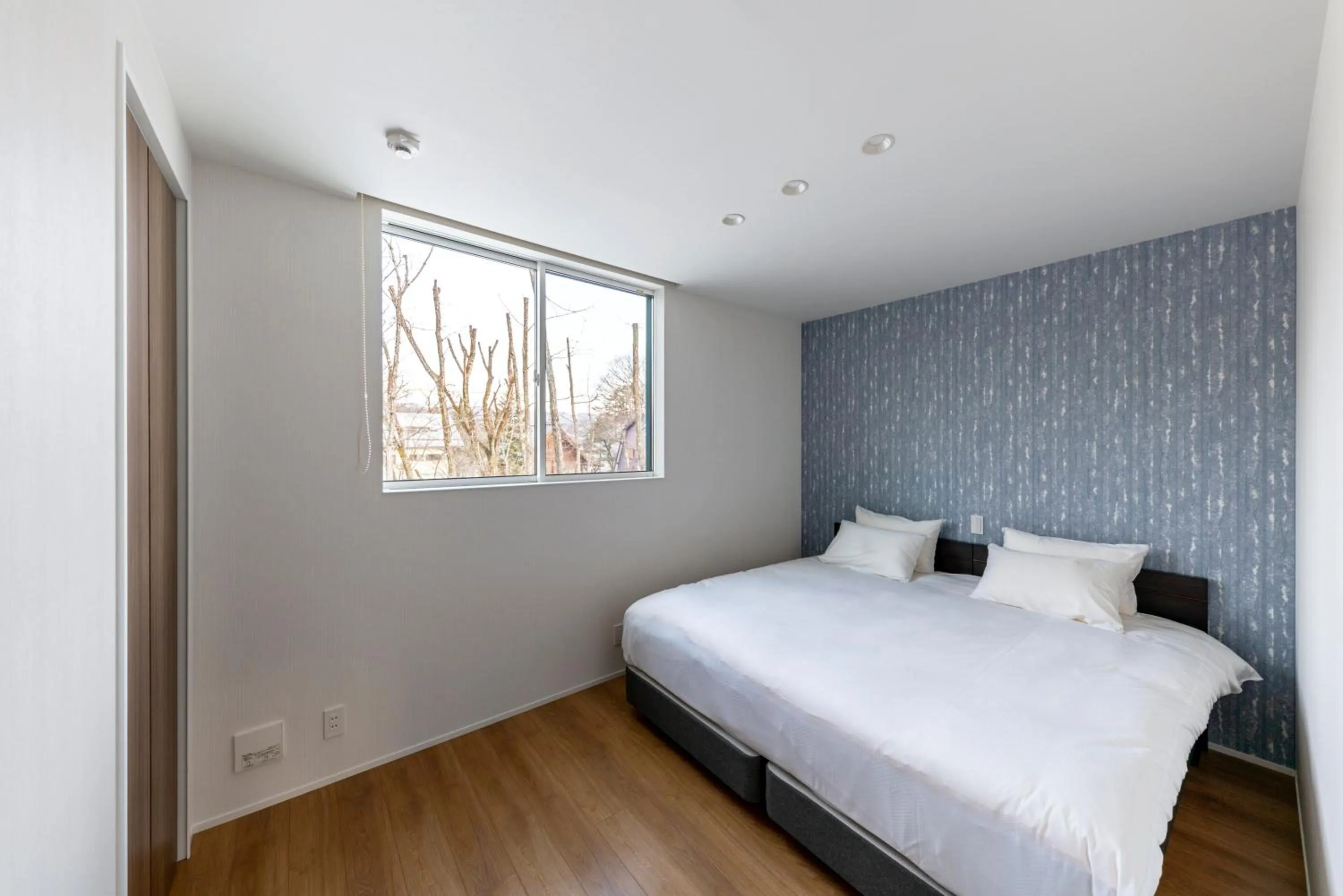 Bed in Grey Wolf Chalet by Hakuba White Fox Company