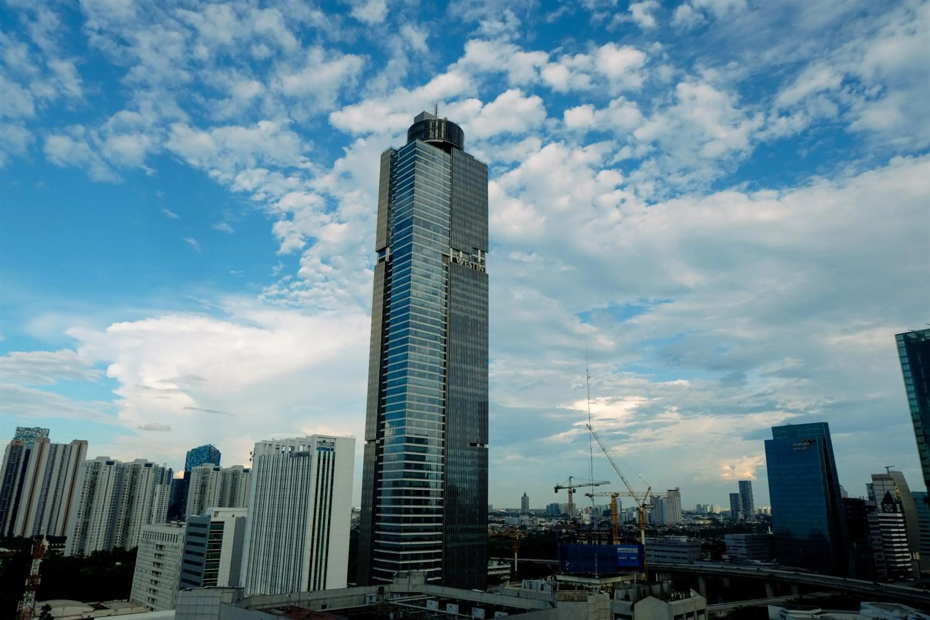 Property building in Spacious 3BR Ambassade Kuningan Apartment By Travelio