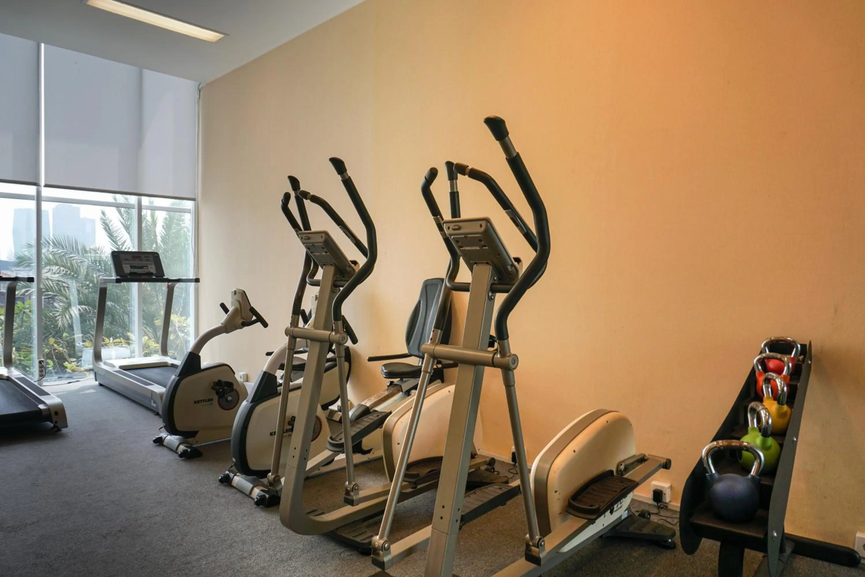 Fitness centre/facilities in Spacious 3BR Ambassade Kuningan Apartment By Travelio