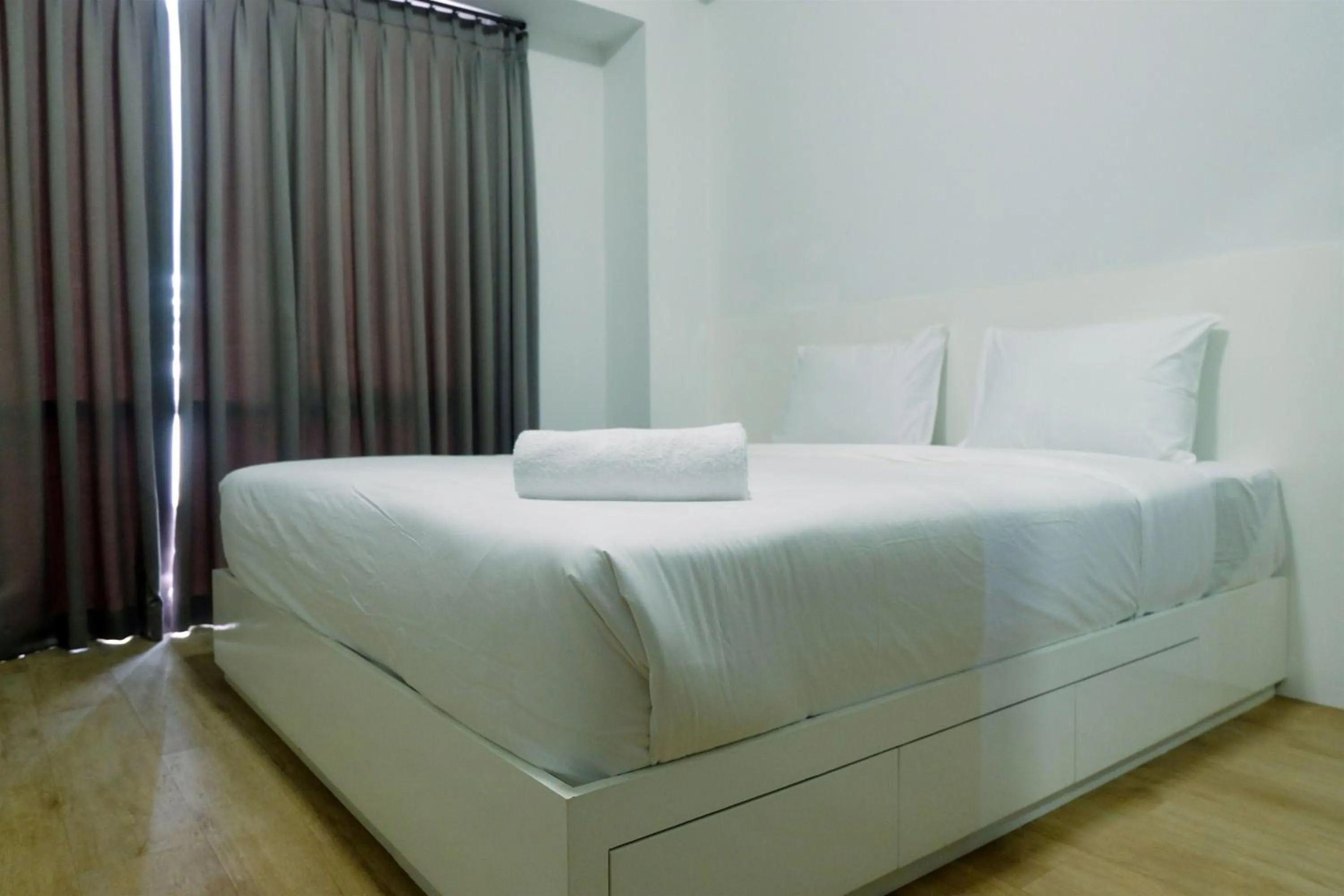 Bed in Spacious 3BR Ambassade Kuningan Apartment By Travelio