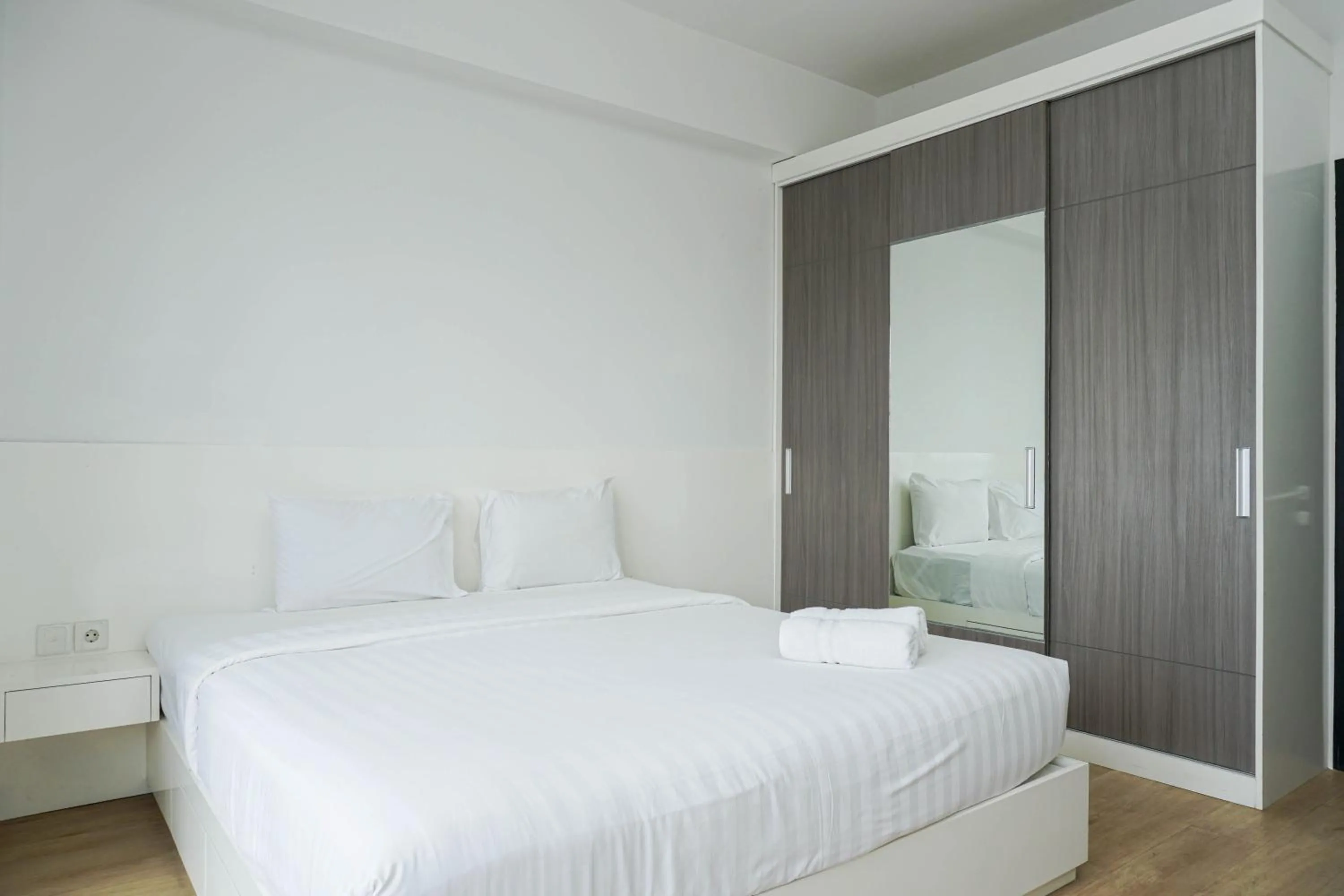 Bed in Spacious 3BR Ambassade Kuningan Apartment By Travelio