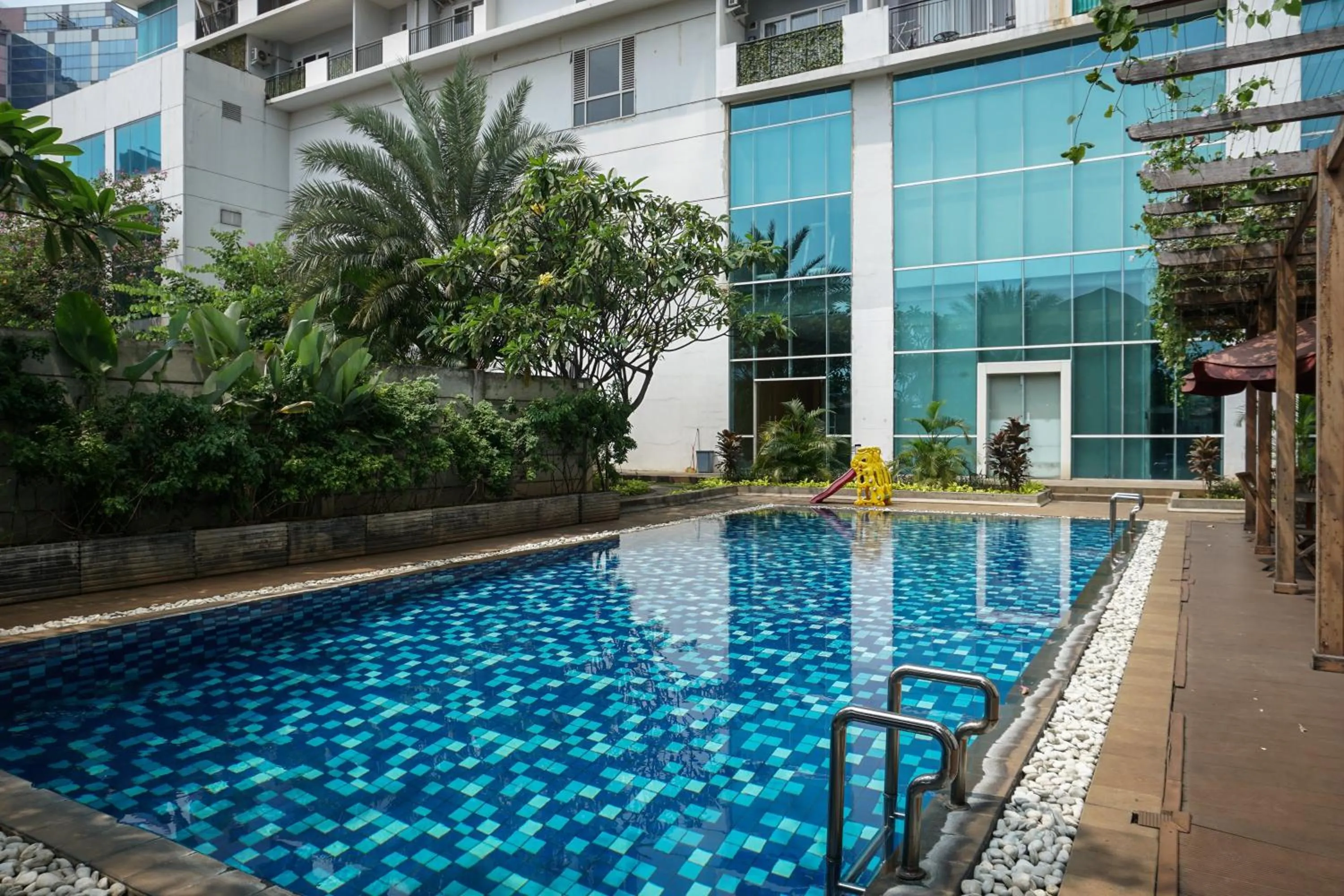 Swimming pool in Spacious 3BR Ambassade Kuningan Apartment By Travelio