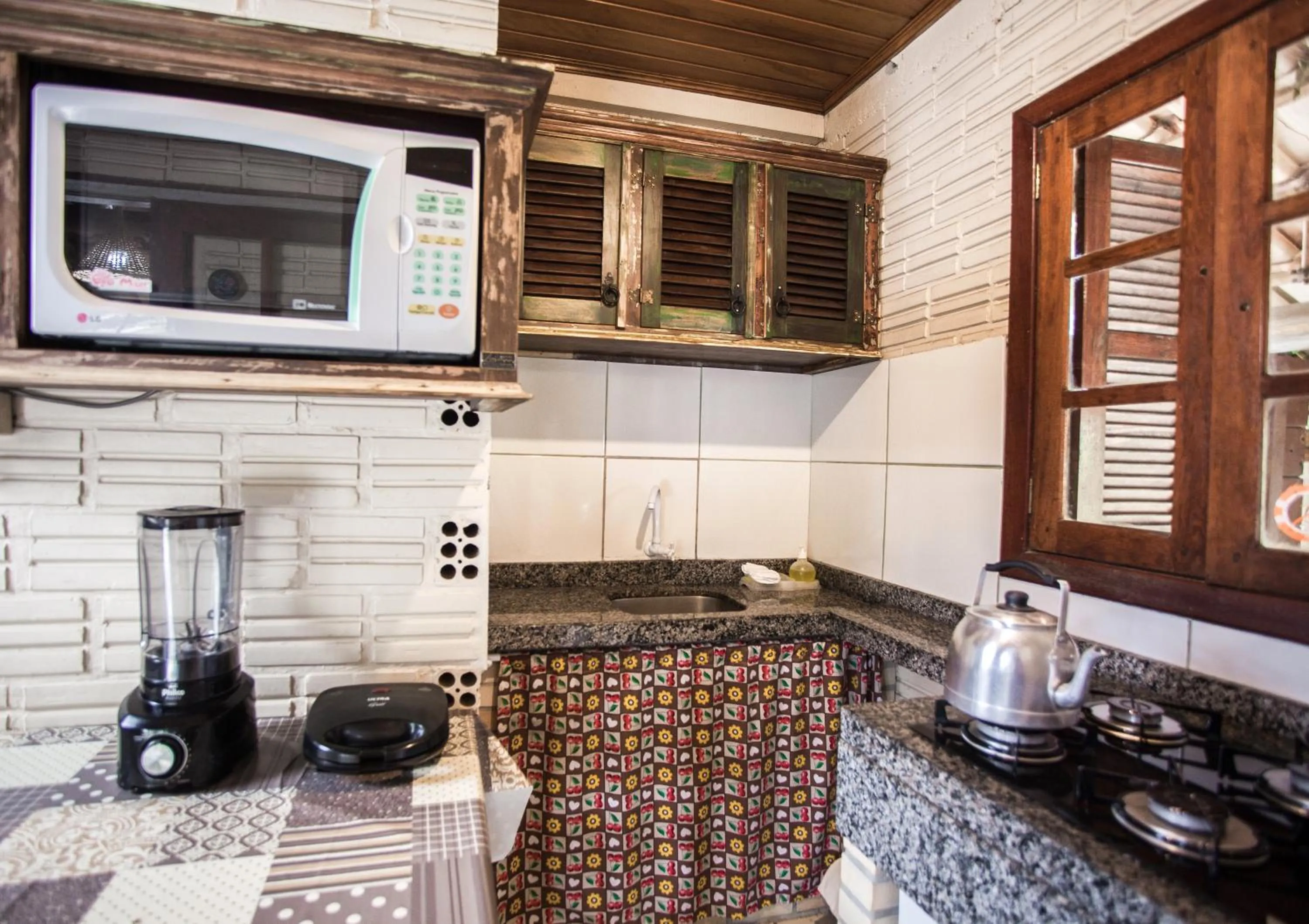 Kitchen or kitchenette in Pousada Cabanas Kaia Lua