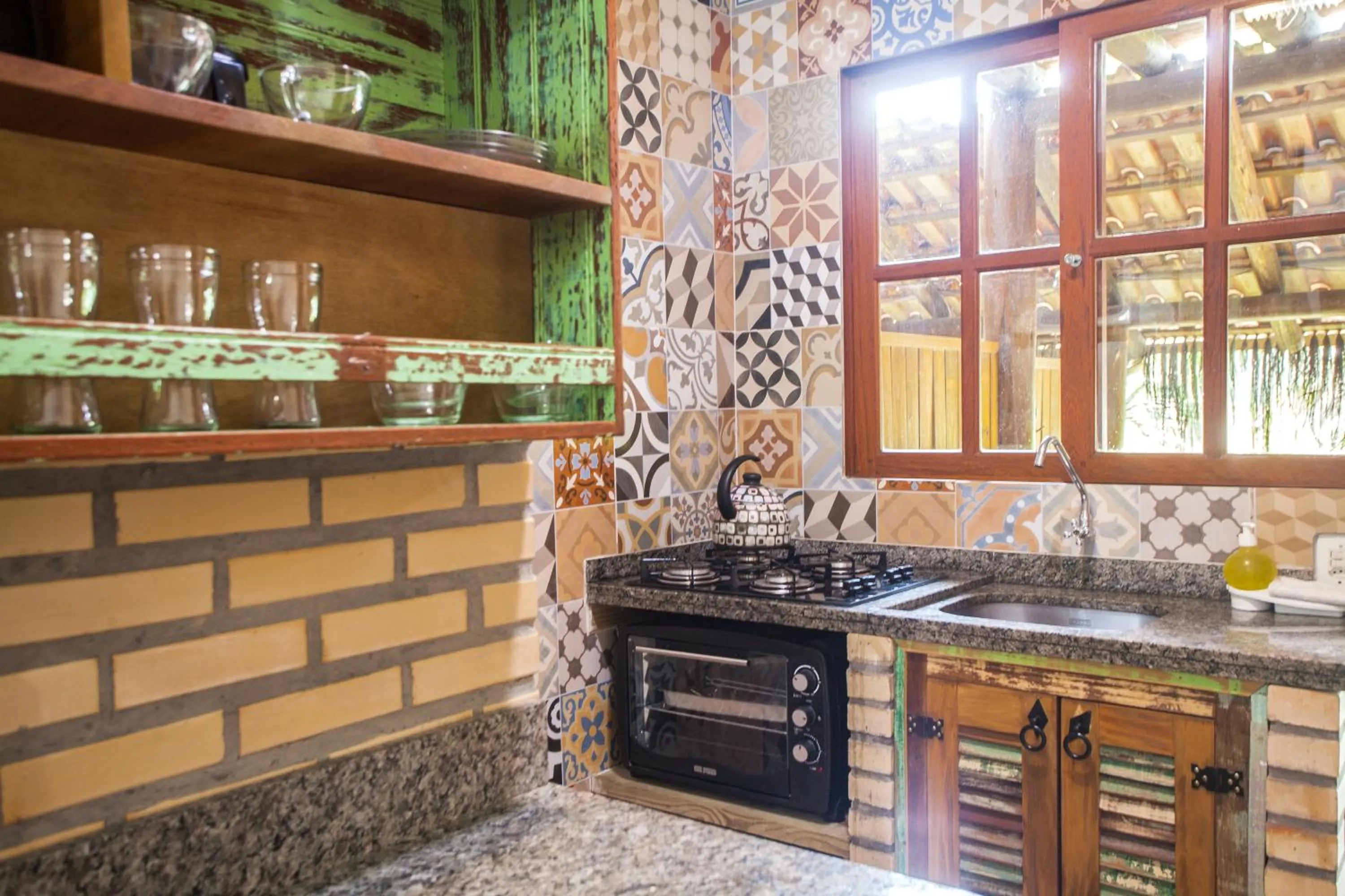 Kitchen or kitchenette in Pousada Cabanas Kaia Lua