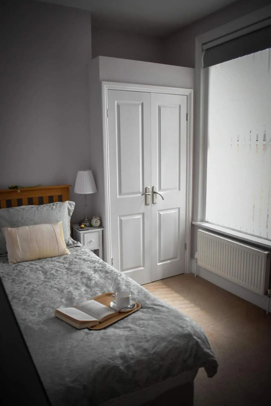 Bed in TLC Exmouth Bed and Breakfast