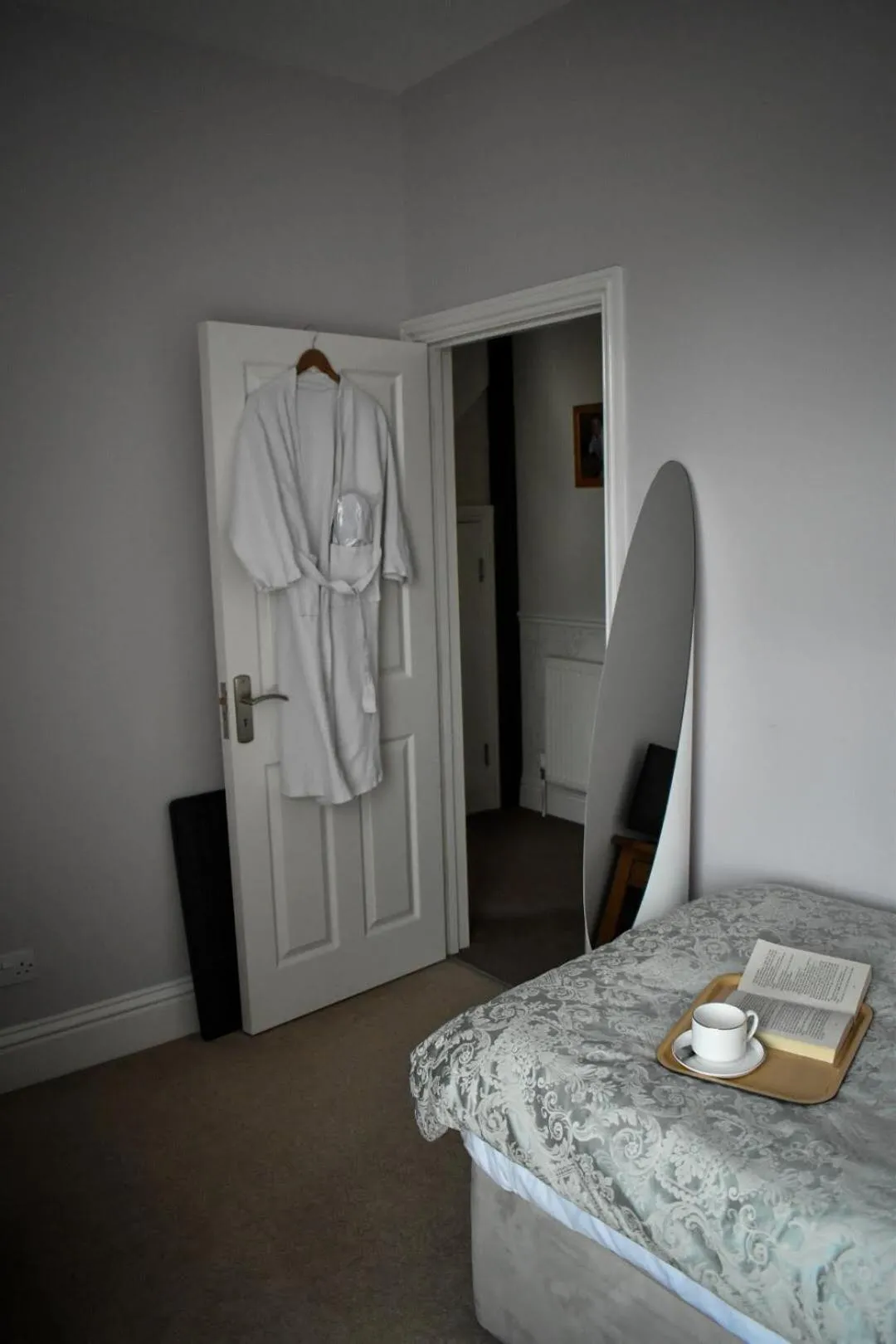 Bed in TLC Exmouth Bed and Breakfast