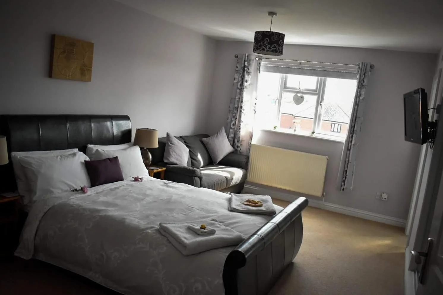 Bed in TLC Exmouth Bed and Breakfast