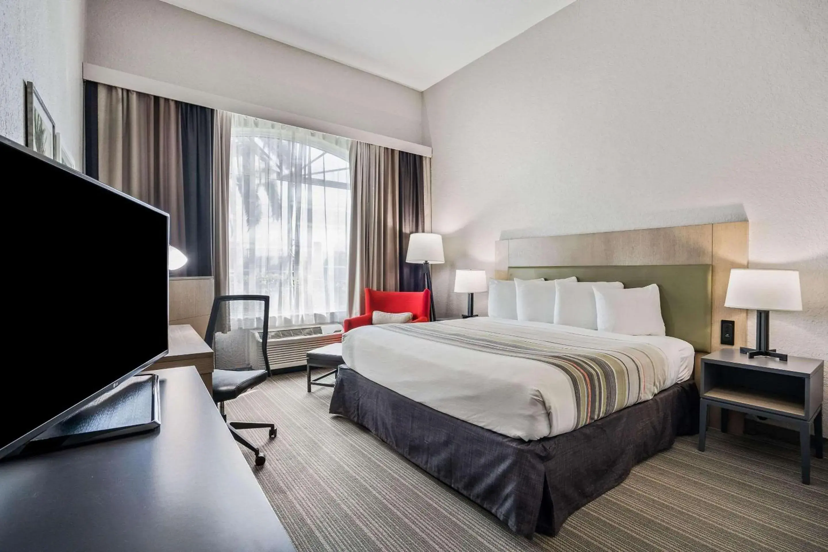 Bedroom, Bed in Country Inn & Suites by Radisson, Port Canaveral, FL Bedroom, Bed in Country Inn & Suites by Radisson, Port Canaveral, FL