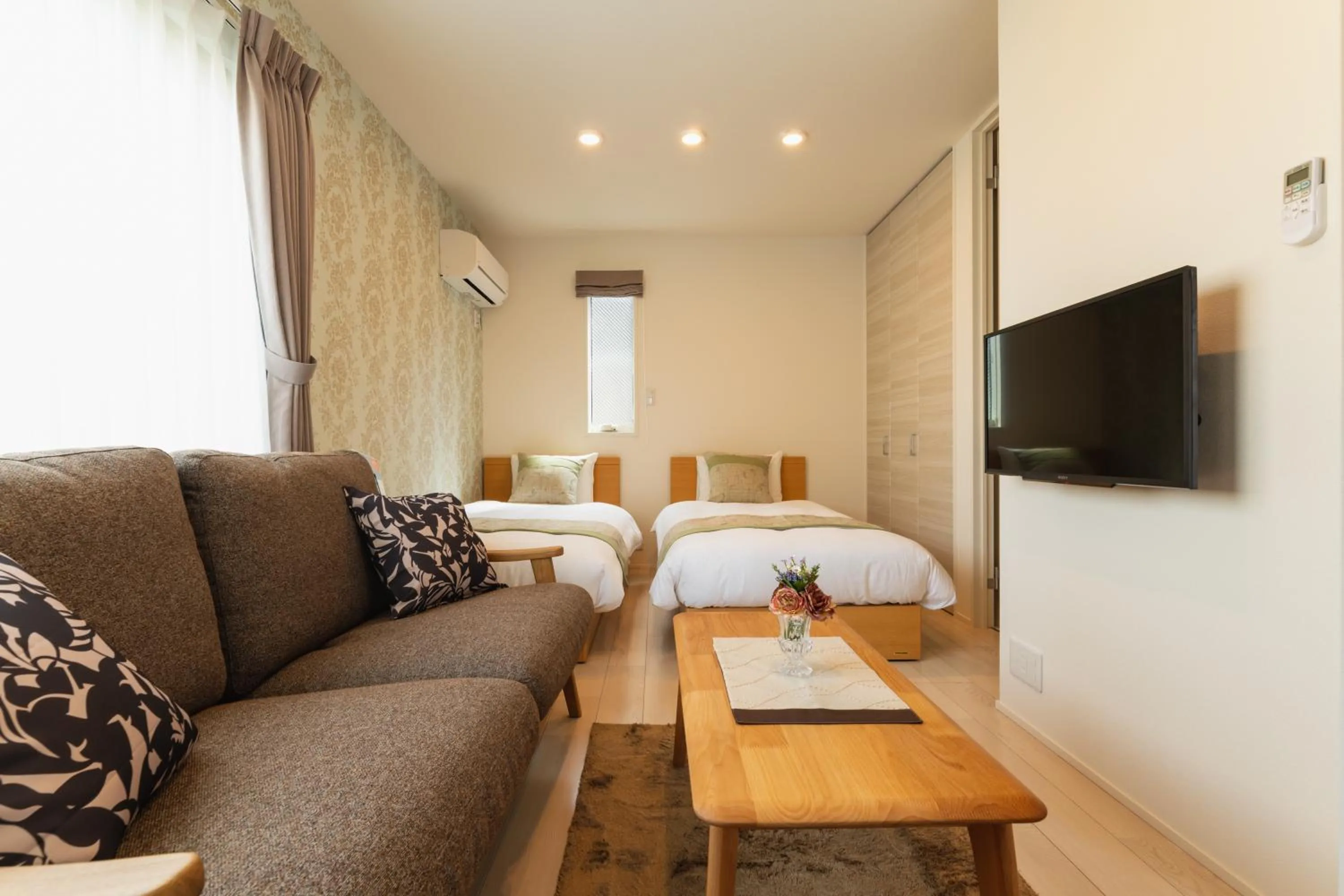 Living room, Bed in Ambicia Sasebo