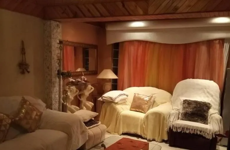 Communal lounge/ TV room in Reemaros Guest House