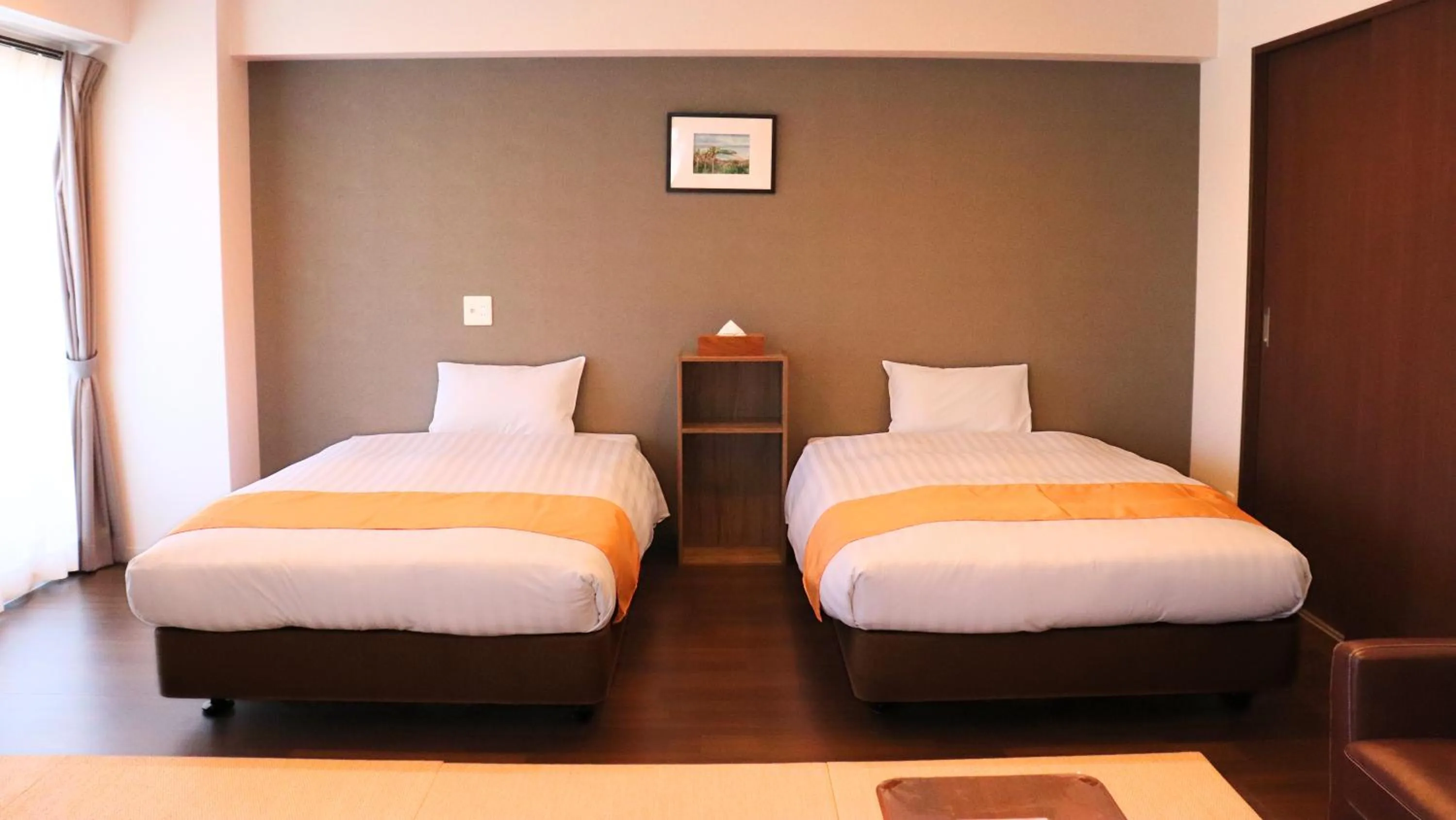 Bed in Apartment Hotel Ecott