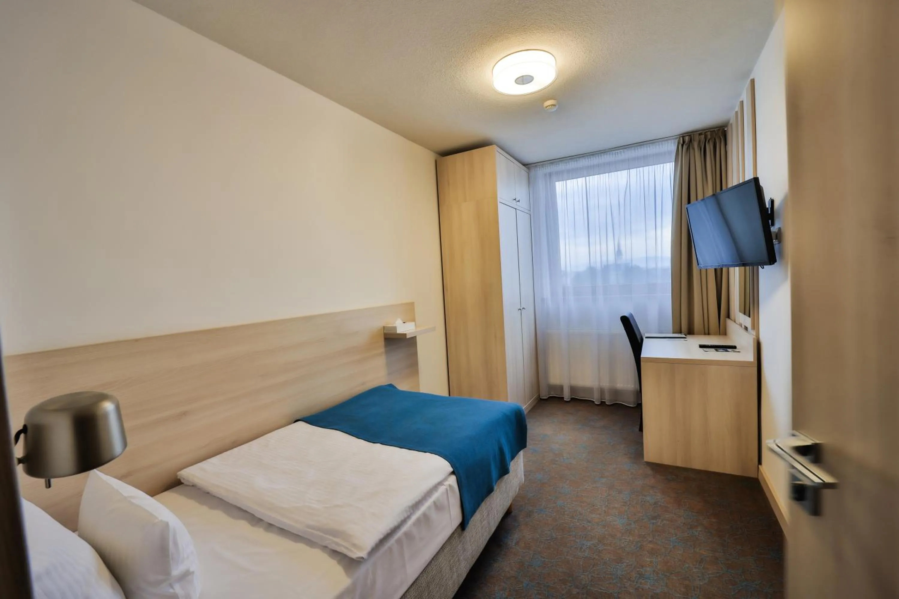 Photo of the whole room, Bed in Hotel Metropol WELLNESS & CONGRESS HOTEL