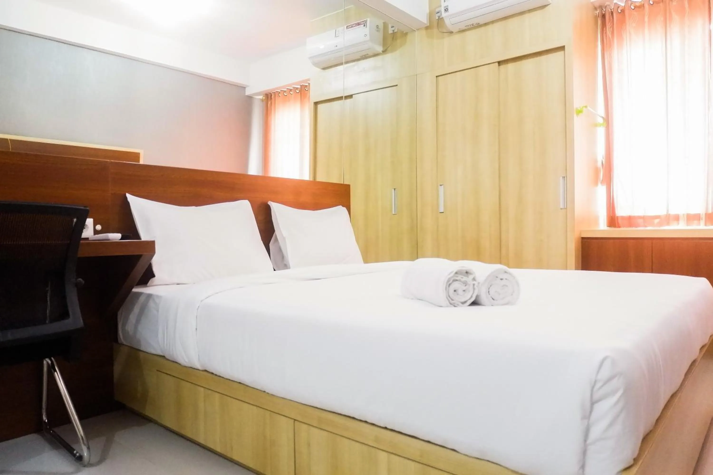 Bed in Comfy Studio Apartment at Menara Rungkut By Travelio