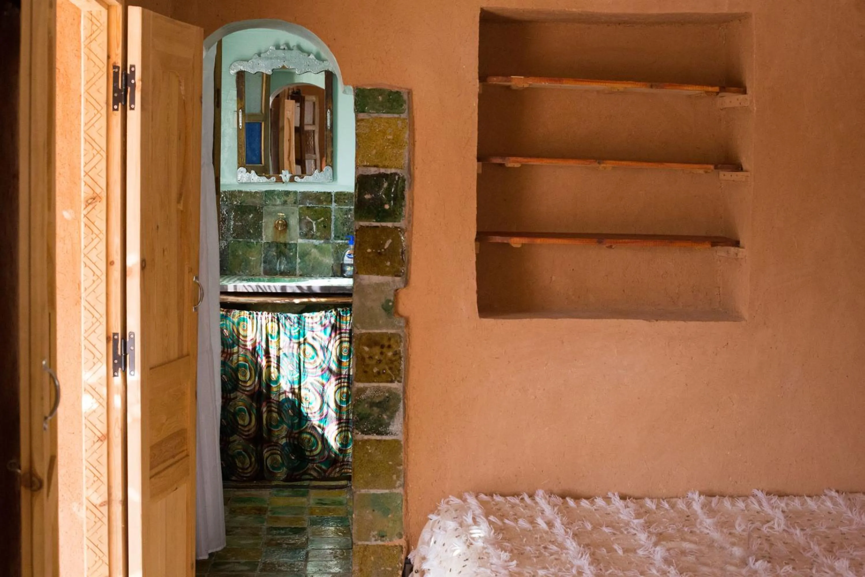 Bathroom, Bed in Ecolodge La Palmeraie