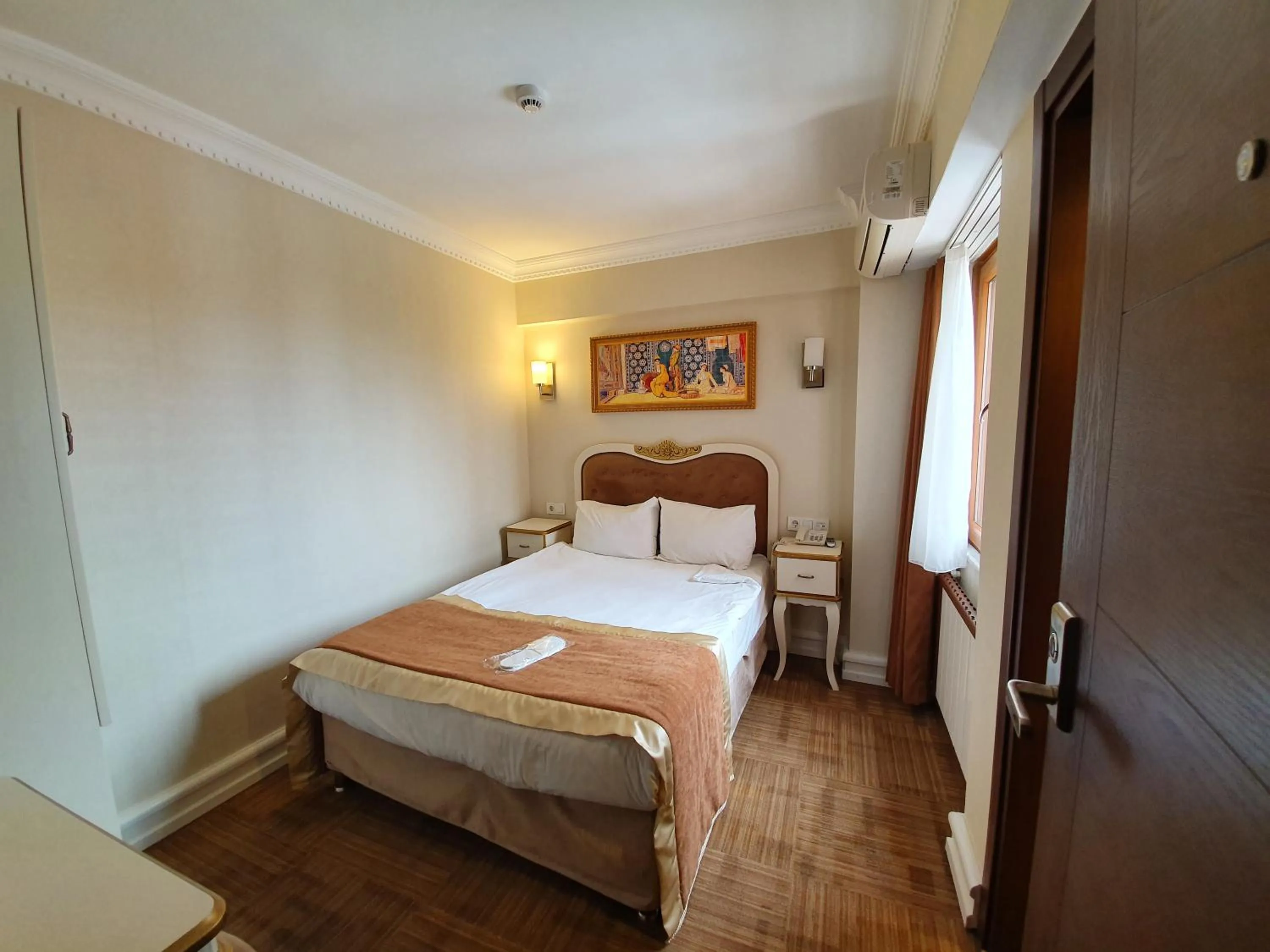 Bed in Elysion Hotel