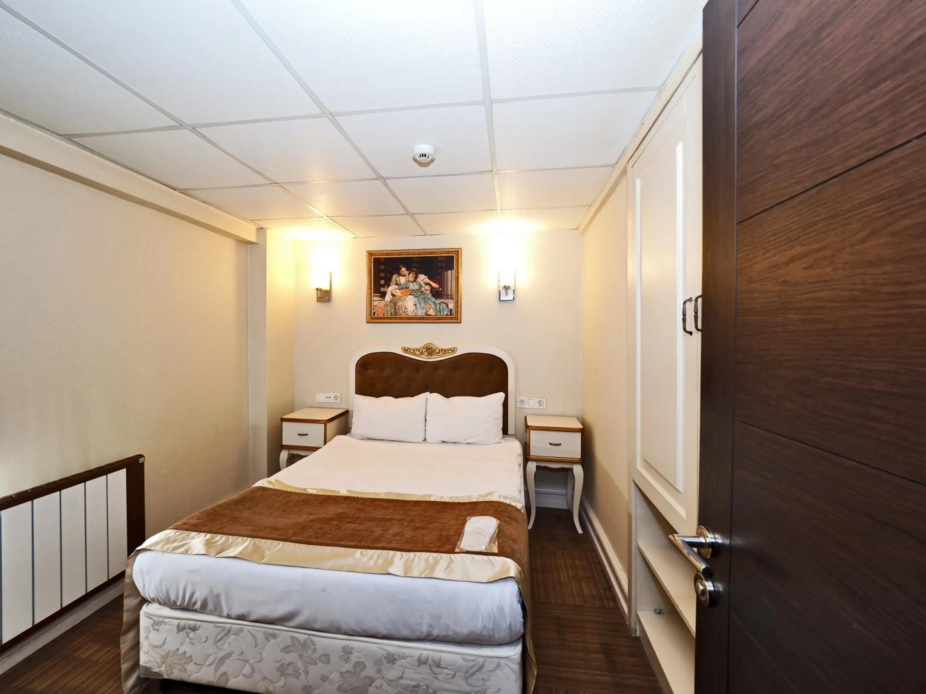 Bed in Elysion Hotel