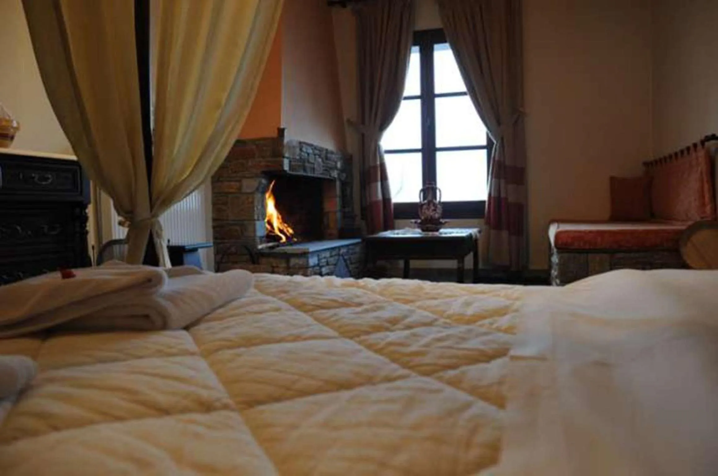 Seating area, Bed in Hotel Atrapos