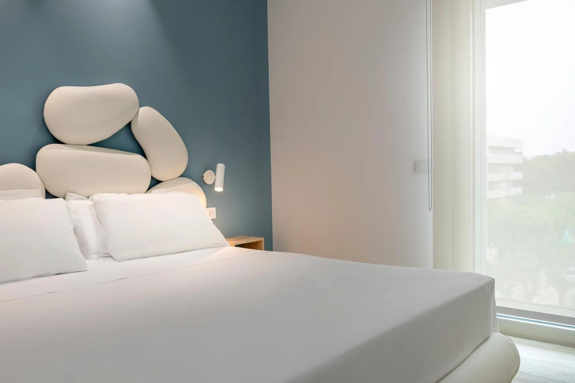 Bed in YOUMAMI Suite Hotel Wellness&Spa