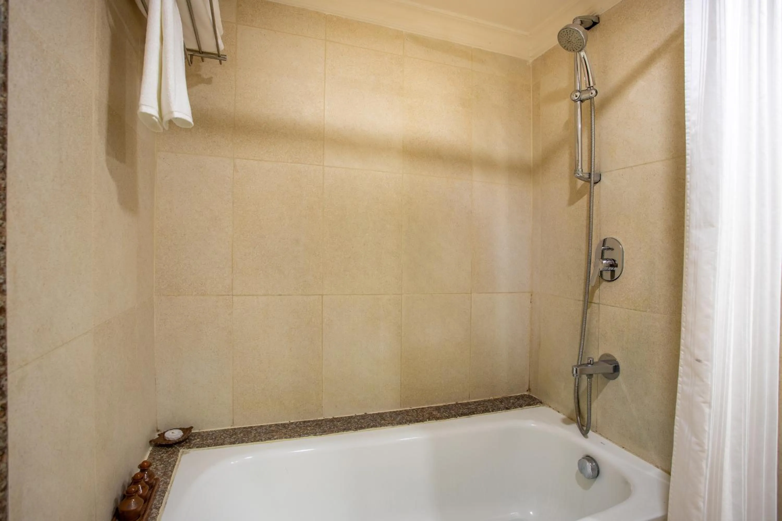 Shower in Atithi Resort & Spa