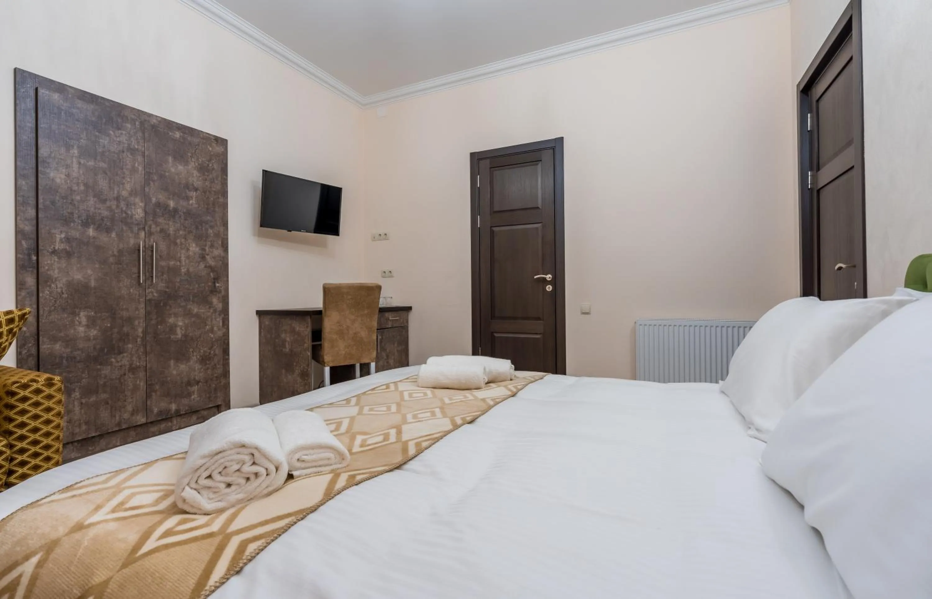 Bed in Golden Light Hotel