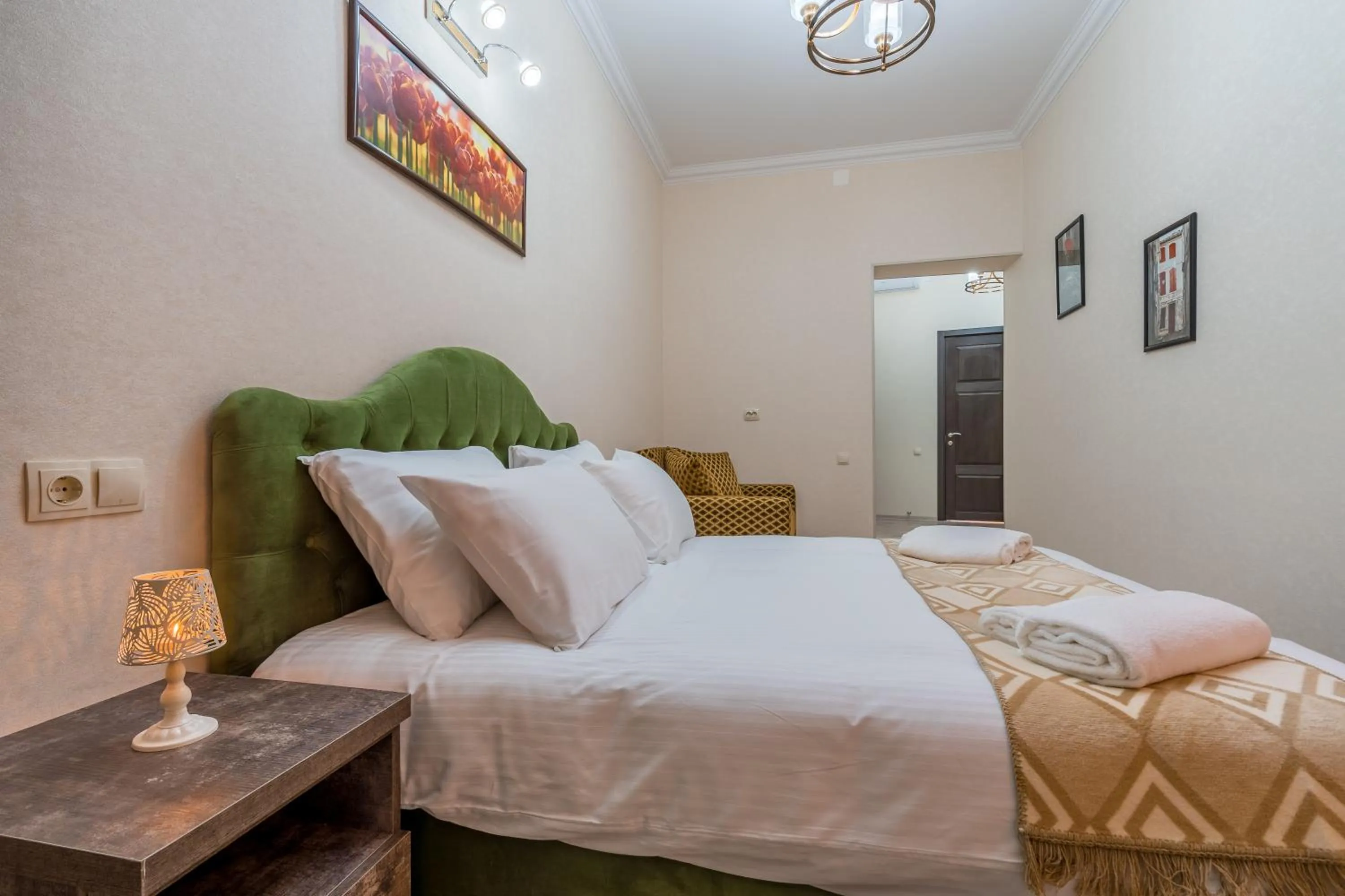 Bed in Golden Light Hotel