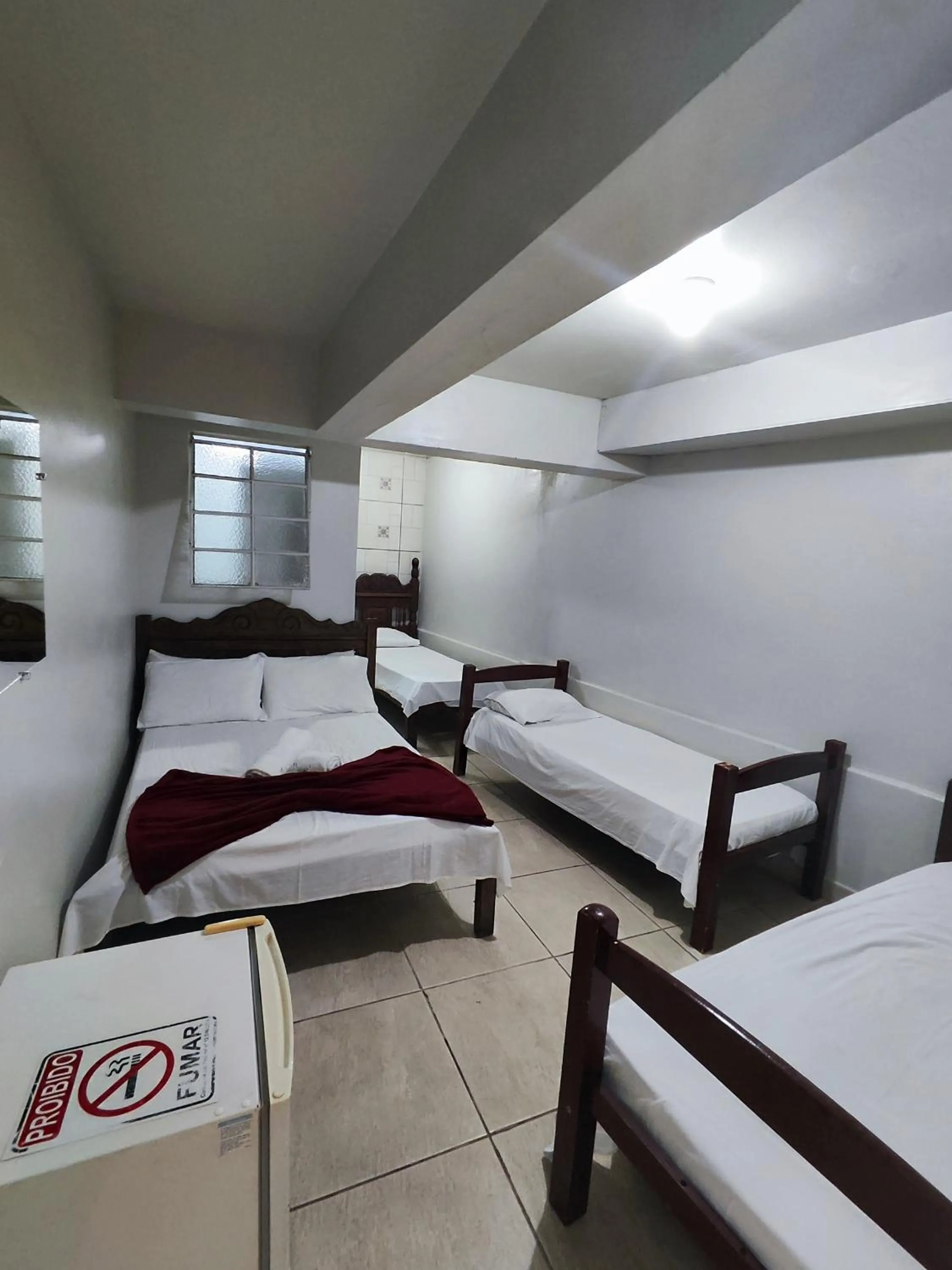 Bed in Pousada Acayaca