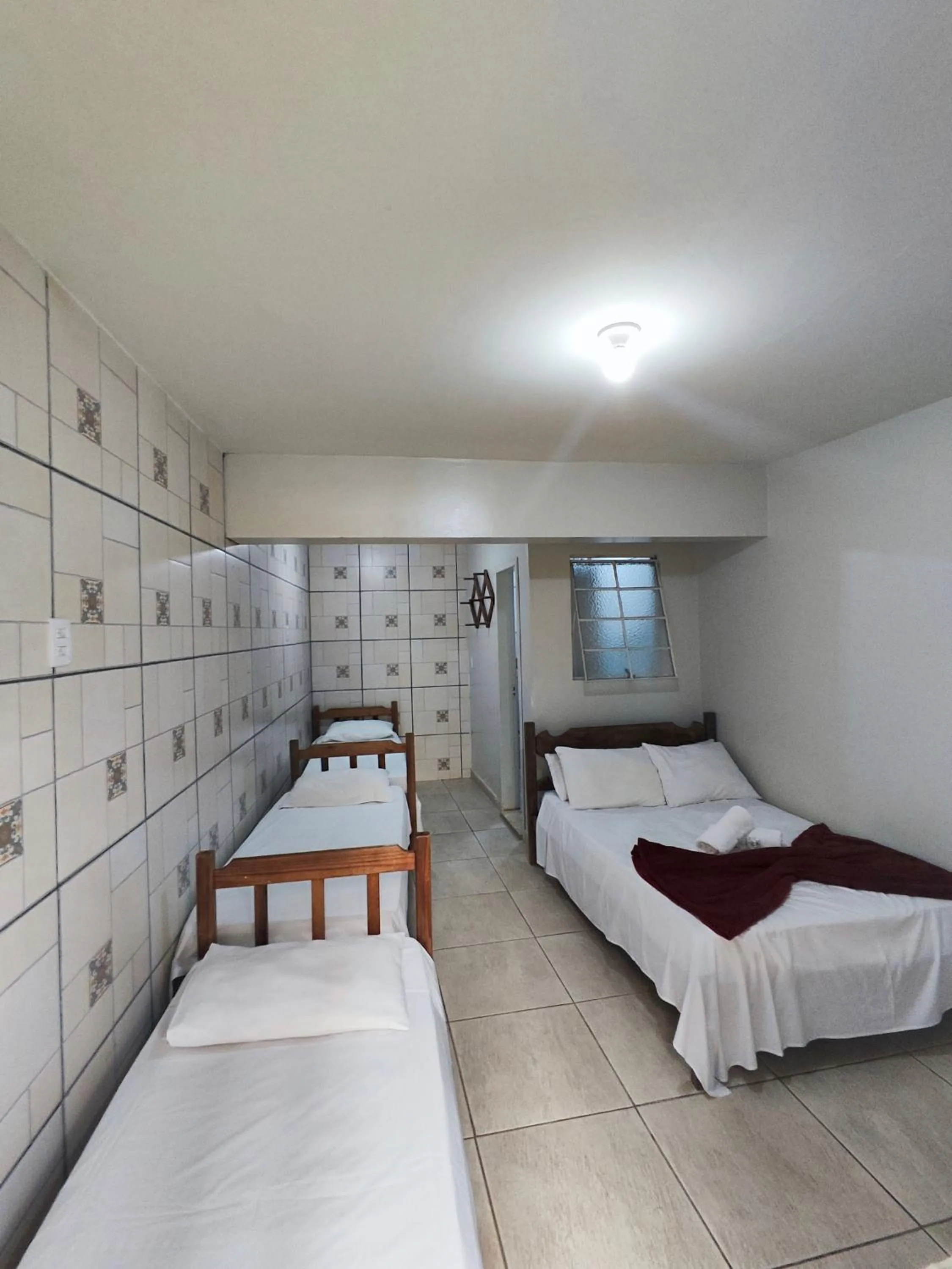 Bed in Pousada Acayaca