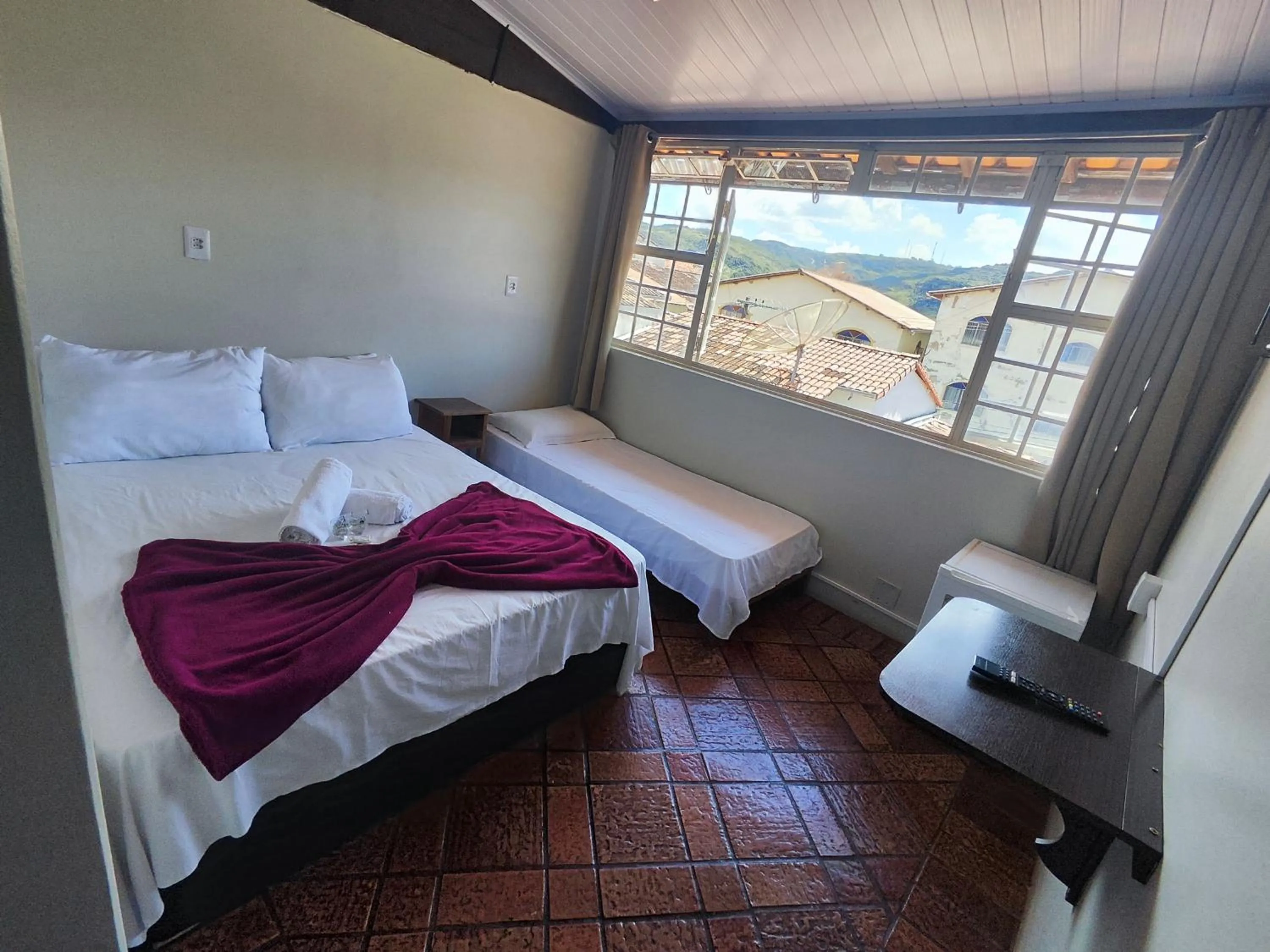 Bed in Pousada Acayaca