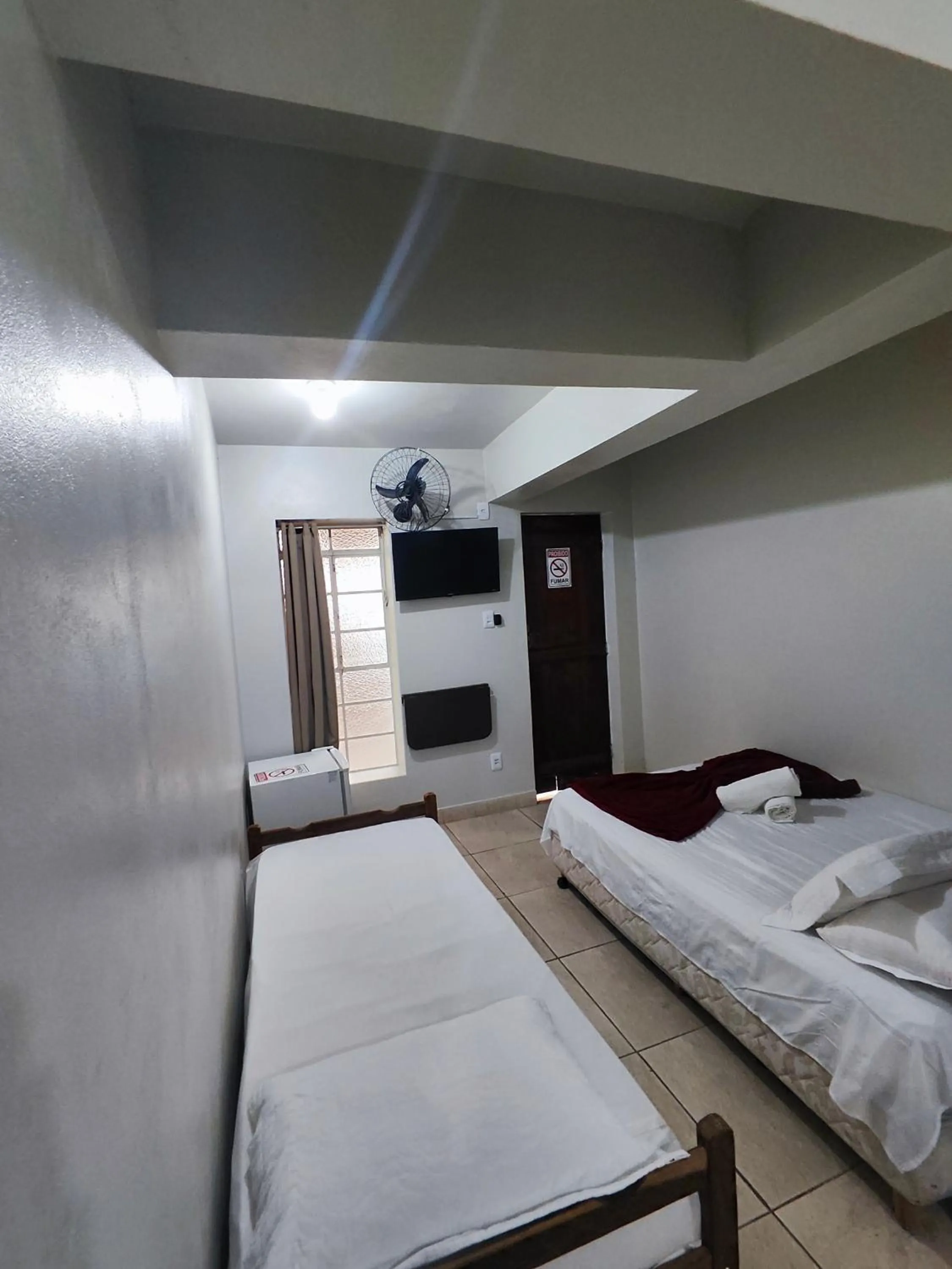 Bed in Pousada Acayaca