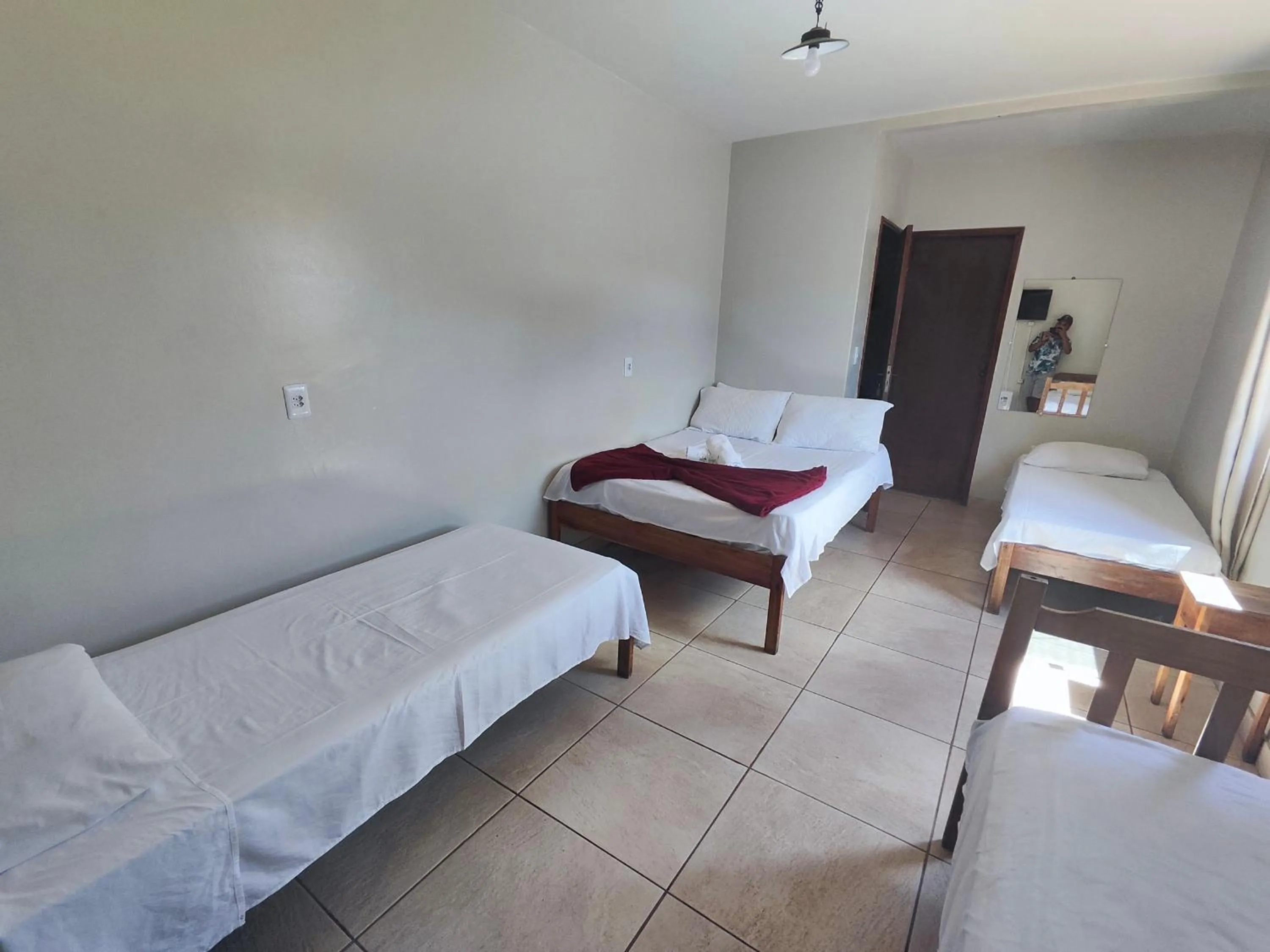 Bed in Pousada Acayaca