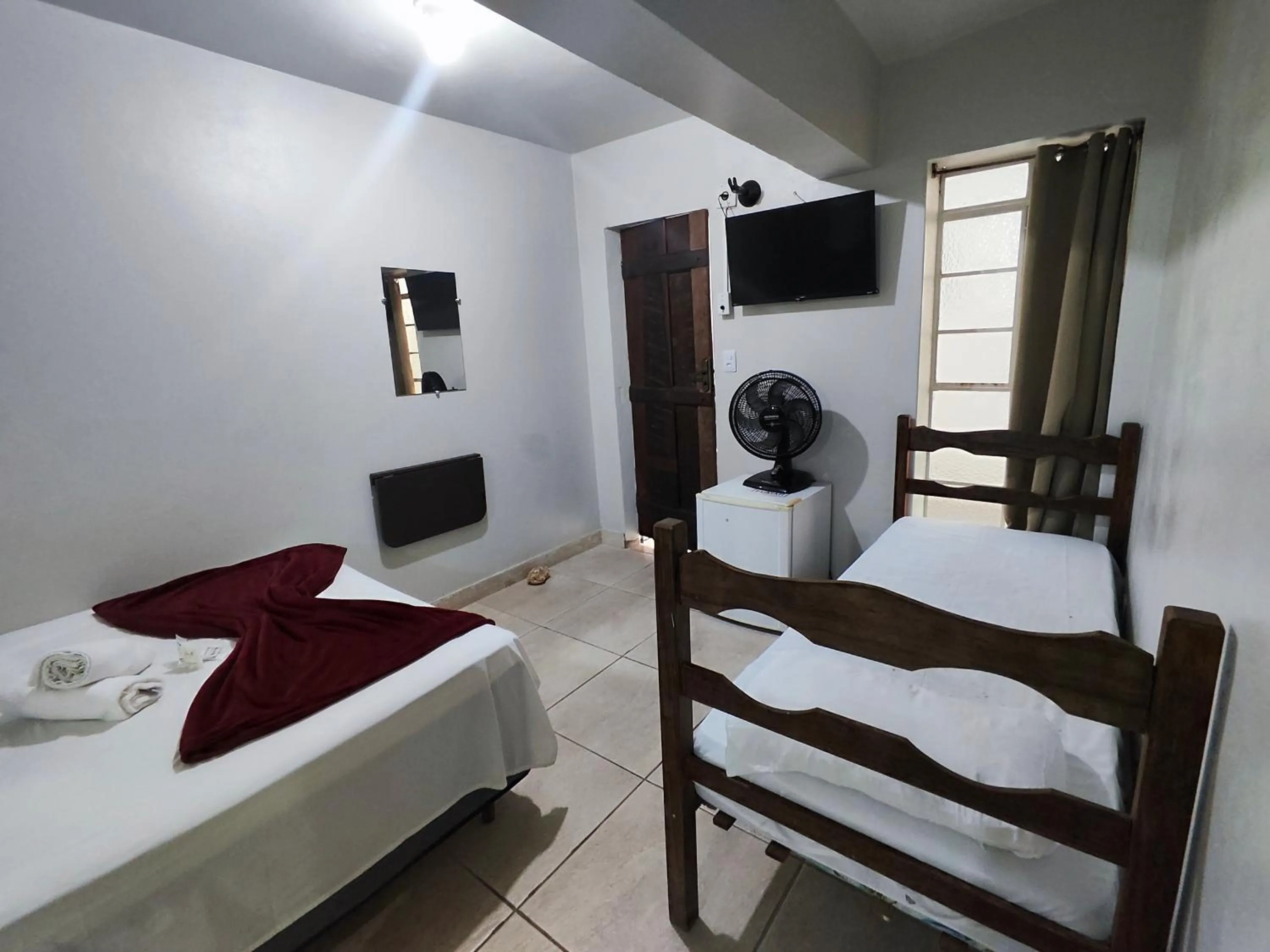 Bed in Pousada Acayaca