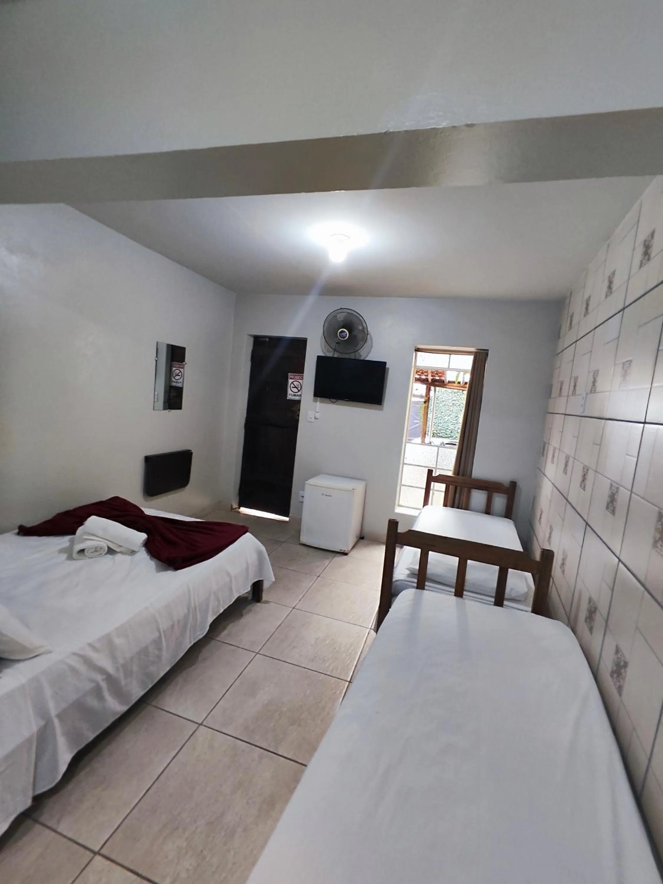 Bed in Pousada Acayaca