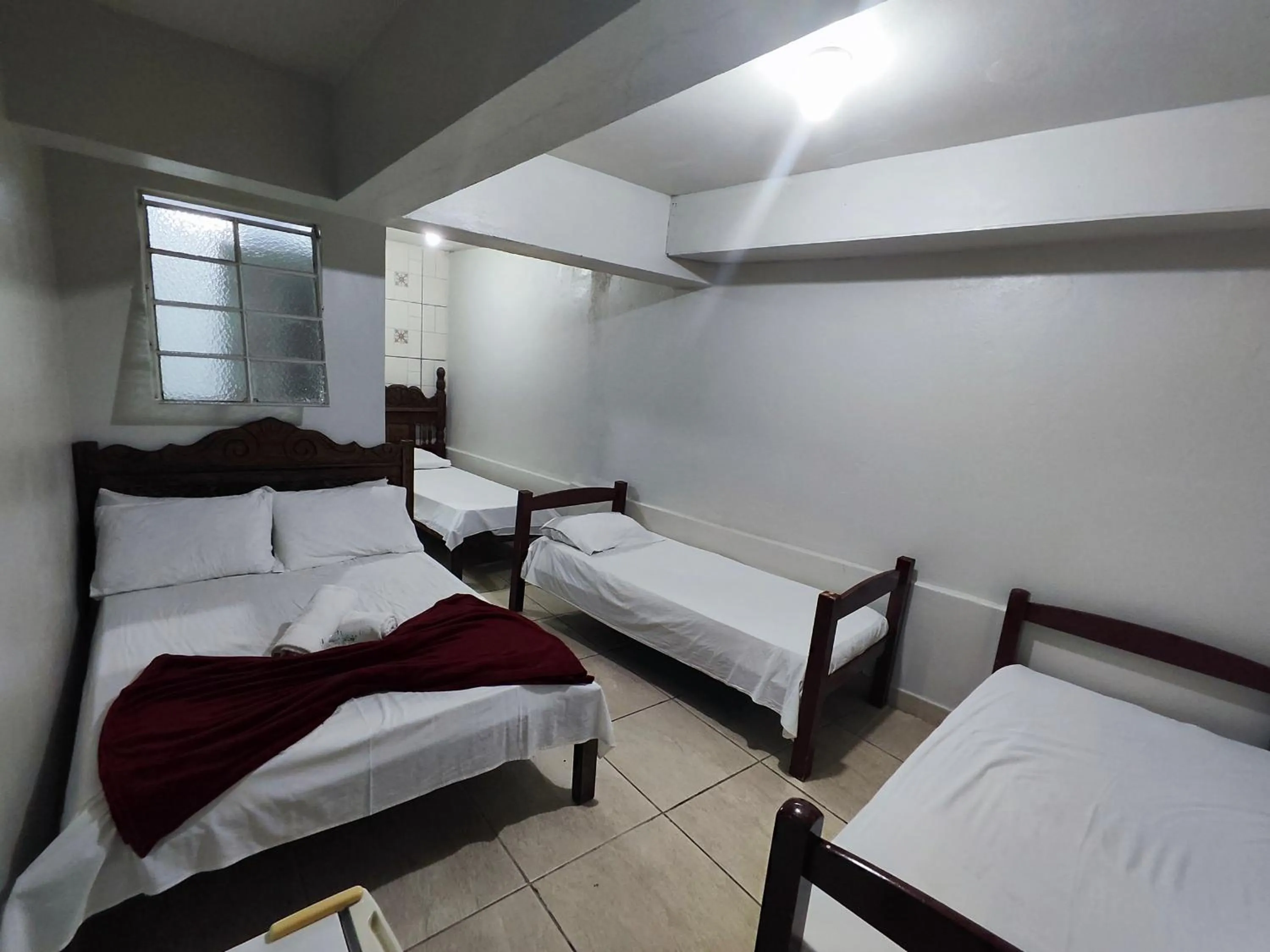 Bed in Pousada Acayaca