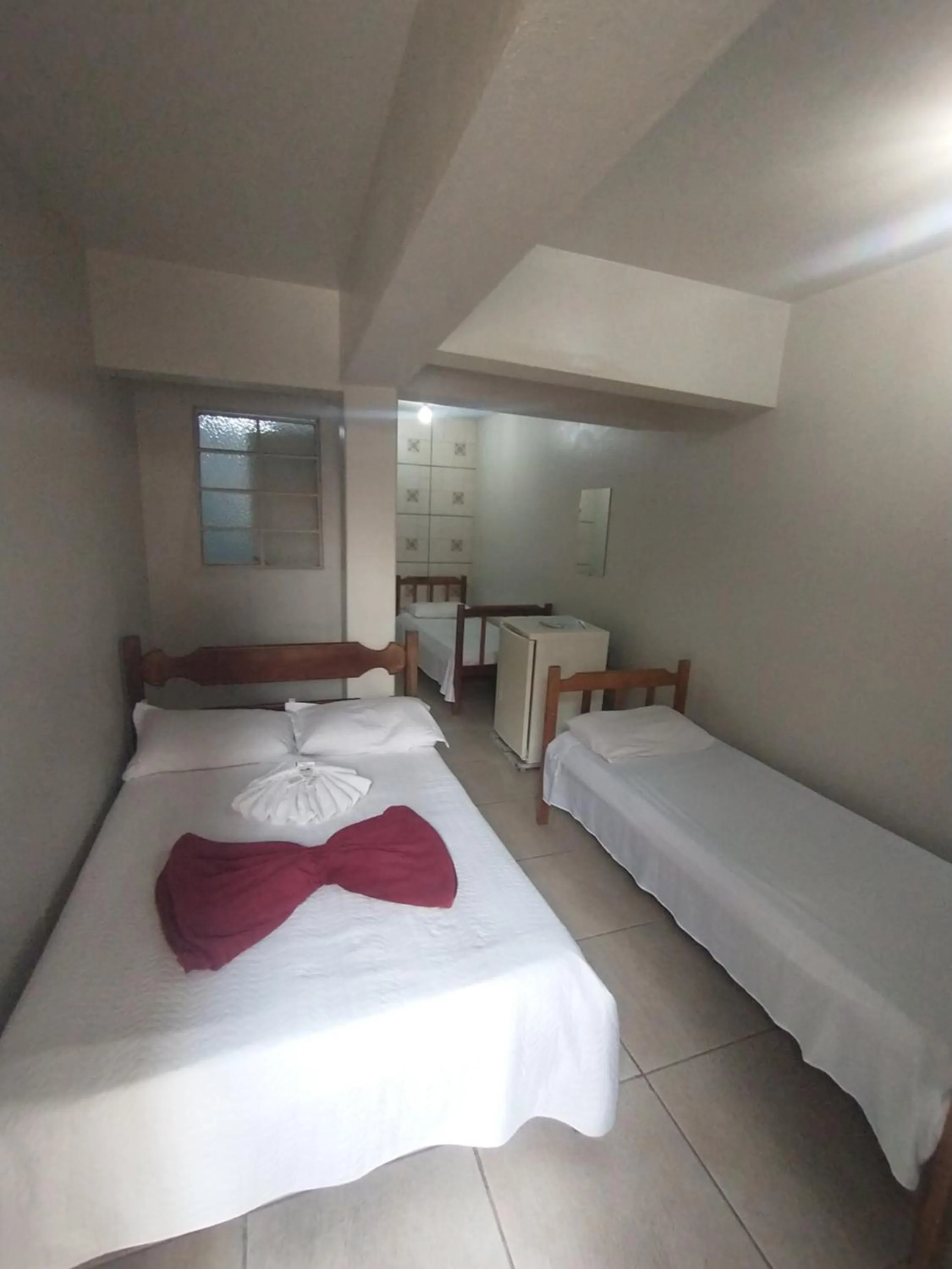 Bed in Pousada Acayaca