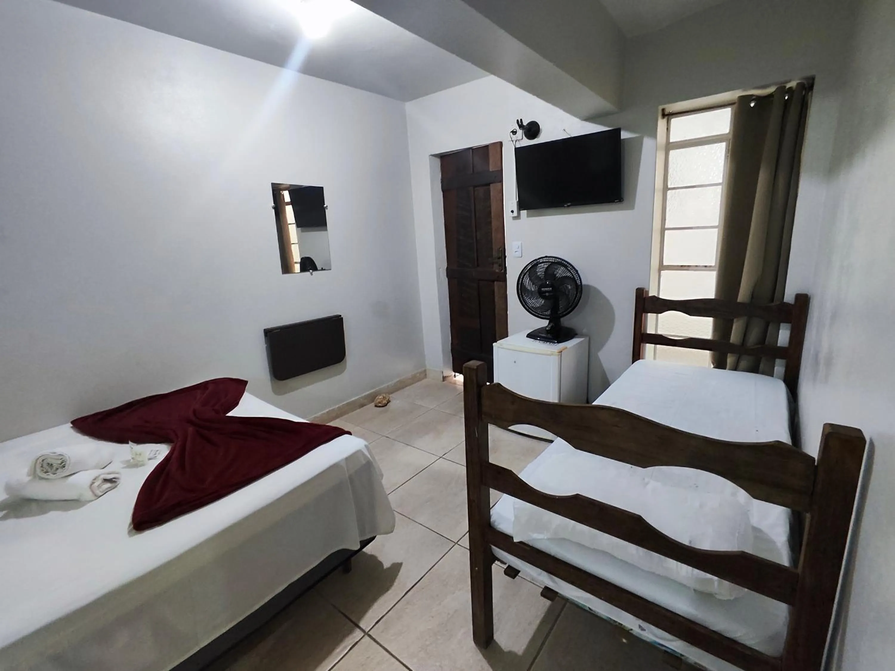 Bed in Pousada Acayaca