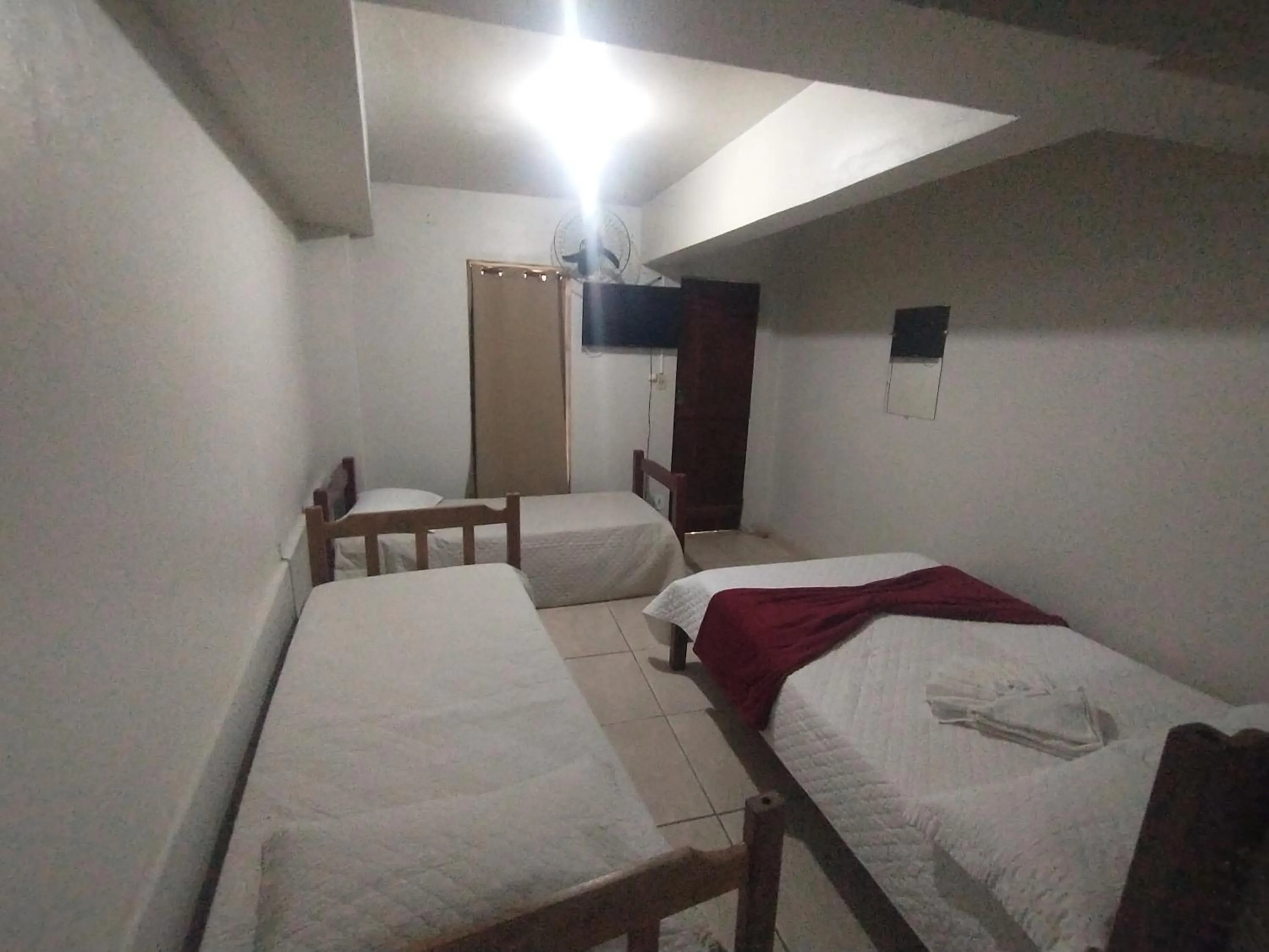 Bed in Pousada Acayaca