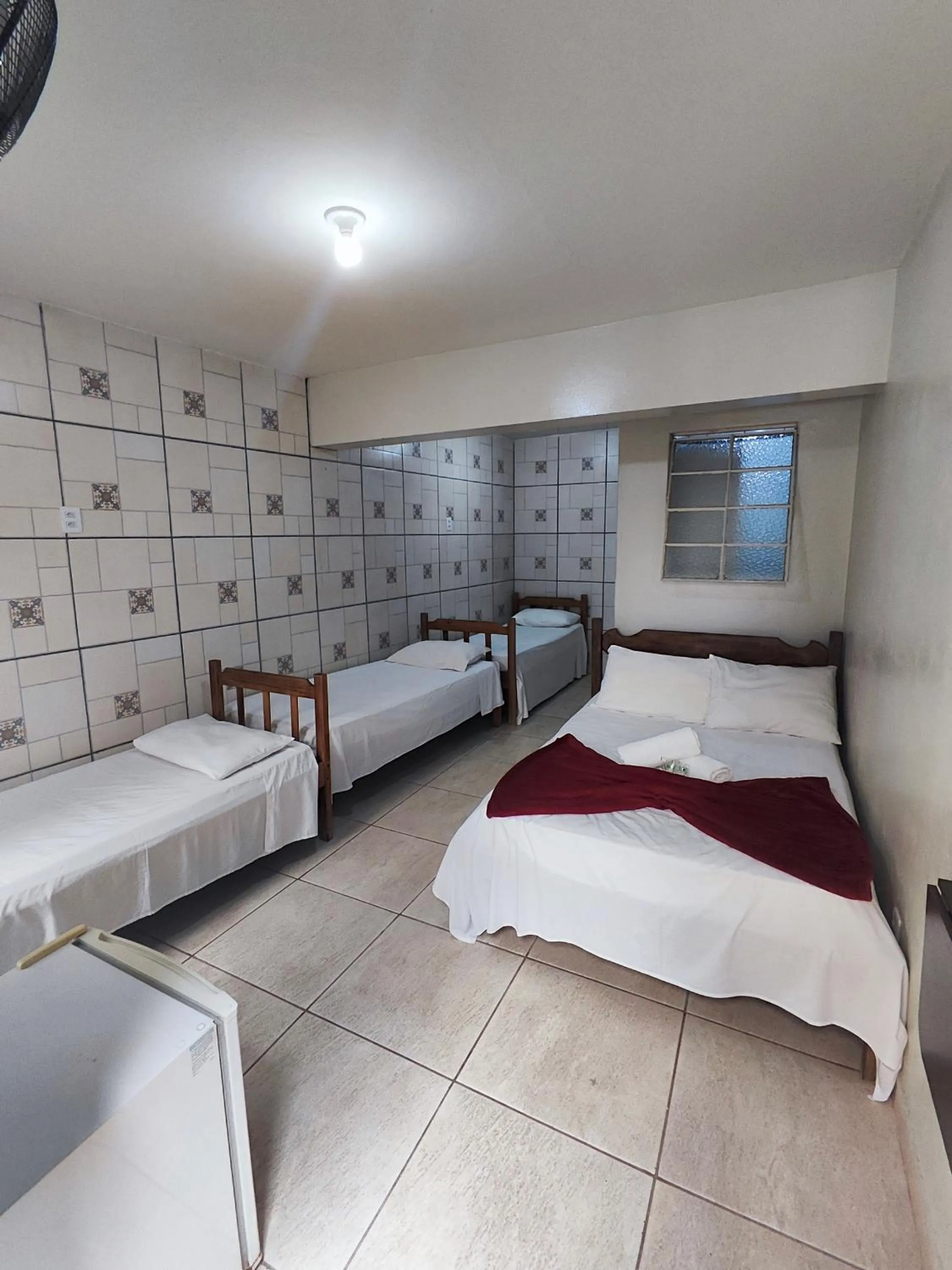 Bed in Pousada Acayaca