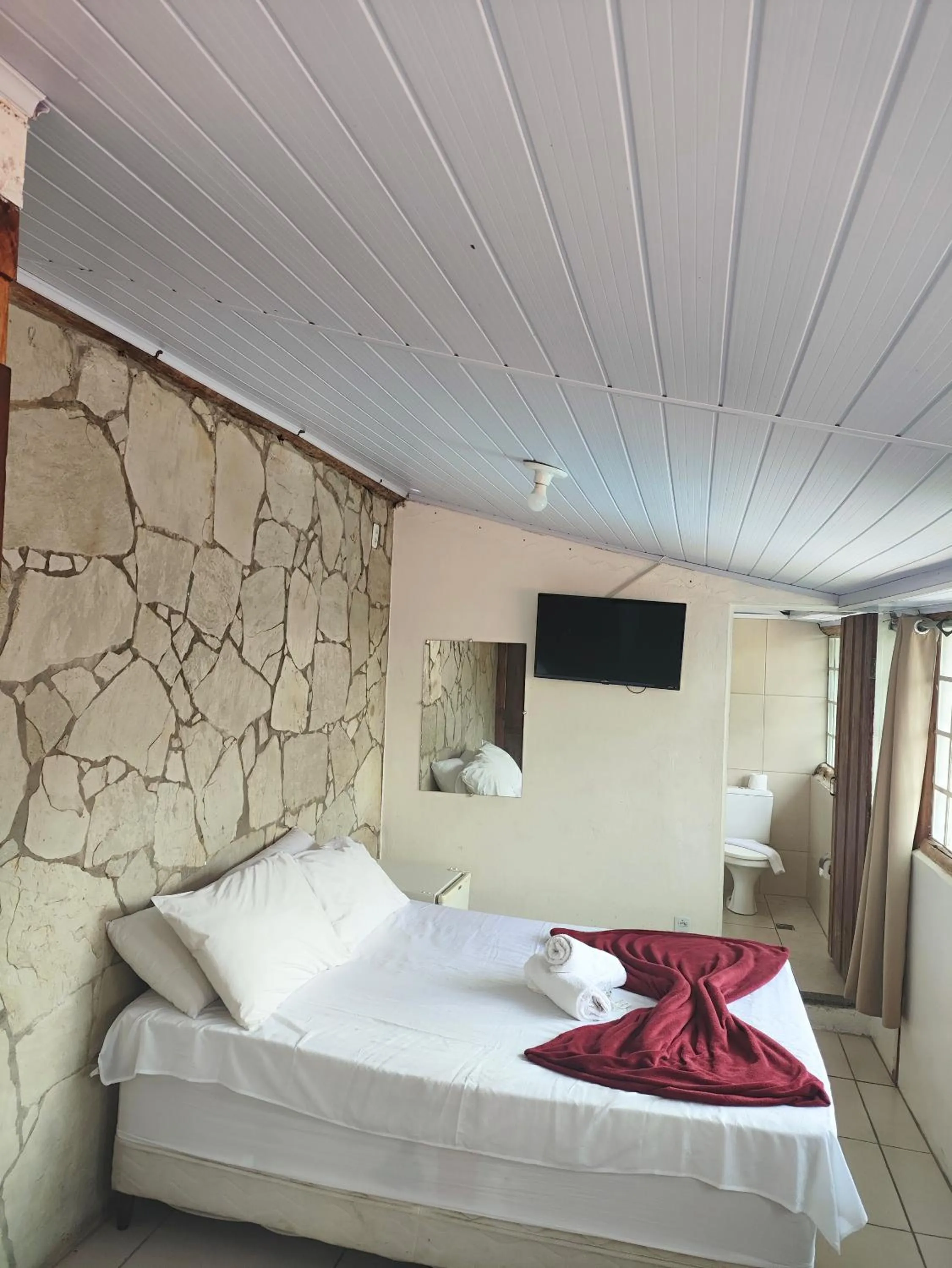 Bed in Pousada Acayaca